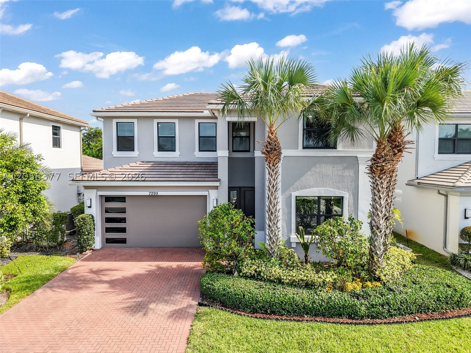 Welcome to this exceptional 6-bedroom, 4-bath + loft home in the prestigious gated community of Villamar at Toscana Isles. Built in 2020, this impeccably maintained home blends sophisticated design, upscale finishes and outstanding energy efficiency. The first-floor primary suite offers dual vanities, separate shower and soaking tub with oversized walk-in closets. The open-concept floor plan is filled with natural light and showcases porcelain tile downstairs, luxury vinyl flooring upstairs, fresh interior paint, custom window shades and designer finishes throughout. At the heart of the home, the gourmet kitchen is designed to impress with an oversized island and an integrated sink, quartz countertops, stainless steel appliances, natural gas cooking and custom cabinetry. The spacious upstairs loft offers endless flexibility as a media room, home office, fitness room or playroom. Additional upgrades include impact windows and doors, A/C system with UV air purification, epoxy garage flooring, a whole-house water filtration system and solar panels, keeping electric bills at approximately $90-$95 per month. Relax or entertain in your private tropical backyard. Toscana Isles offers a resort-style clubhouse, pool, tennis courts, parks, walking trails, playgrounds, a low HOA, and convenient access to shopping, dining, major highways, and top-rated schools. Luxury, comfort, and exceptional value make this move-in-ready home a rare opportunity.