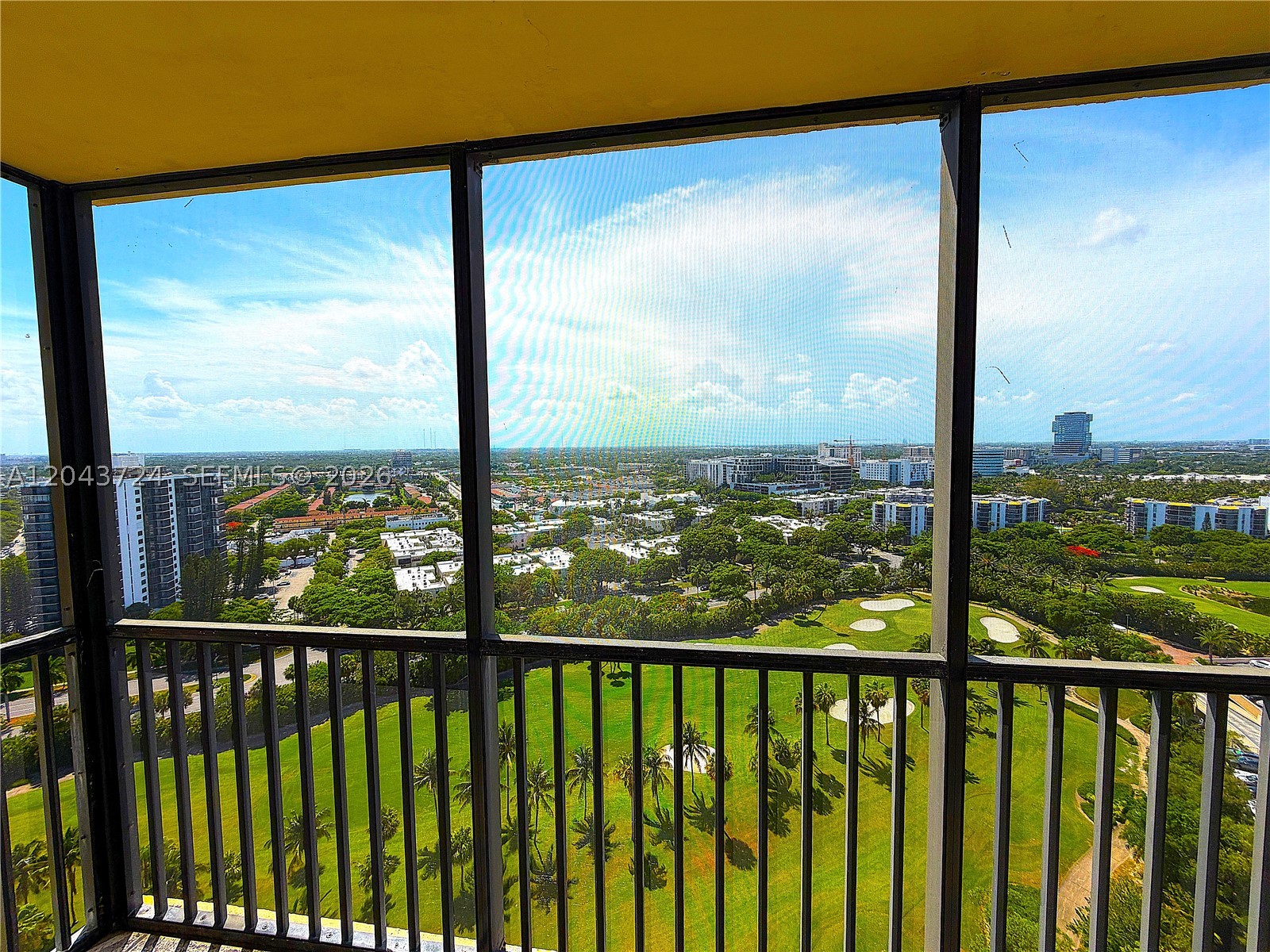 Stunning unobstructed panoramic golf and city views highlight this beautifully updated residence in the heart of Aventura. The remodeled kitchen features granite countertops, stainless steel appliances, updated cabinetry, and a pass-through window overlooking the breathtaking views. Additional upgrades include tile flooring throughout and renovated bathrooms. Ideally located just steps from Aventura Mall, Publix, restaurants, and shopping, this home is only 5 minutes from the beach and directly across from the scenic 3.5-mile Turnberry walking and biking path. Enjoy convenient access to major highways, parks, entertainment, and everything South Florida has to offer. Resort-style amenities include a heated pool, jacuzzi, fitness center, sauna, 24-hour security, and covered parking. Maintenance includes hot and cold water, cable, and high-speed internet. A perfect opportunity to enjoy the Aventura lifestyle with spectacular views and an unbeatable location.