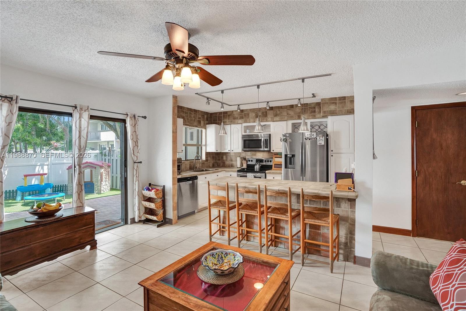 Beautifully updated 2-story townhouse in the heart of Sunny Isles, just minutes from the beach! This spacious 3 bed, 2.5 bath home features a bright, open layout with fully renovated kitchen with sleek ceramic tile, center island, tile floors, and ample storage. Upstairs you'll find oversized bedrooms with each with ensuite closets. Enjoy a private front courtyard and large rear terrace—perfect for outdoor dining, BBQ'ing and entertaining. Pet-friendly community with a sparkling pool. Prime location close to beaches, shopping, dining, and top-rated schools. Ideal for end-users or investors!