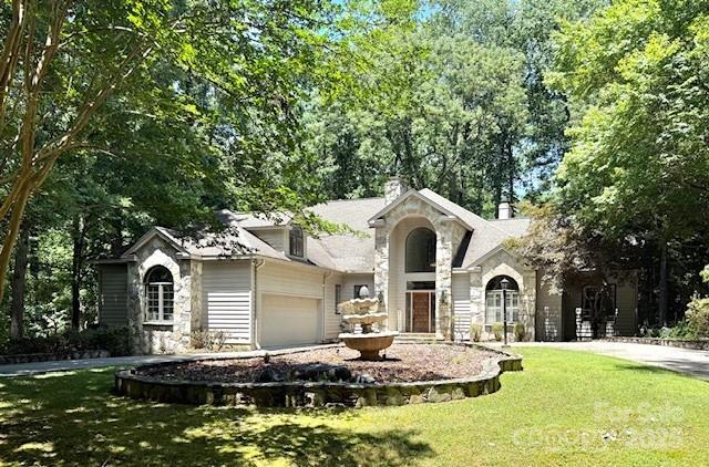 Experience luxury living at its finest in this exquisite 7,000 + square foot custom-built home, nestled on a private, beautifully landscaped lot with peek-a-boo views of the lake. This architectural masterpiece seamlessly blends timeless elegance with modern comfort, offering ornate detailing throughout and soaring floor-to-ceiling windows that flood the interiors with natural light and frame picturesque vistas from nearly every room.
Step inside to discover a grand foyer with intricate millwork and rich finishes that set the tone for the home's exceptional craftsmanship. The expansive open floor plan features multiple living and entertaining spaces, including a formal living room, a cozy fireside family room, and a gourmet chef’s kitchen custom cabinetry, and a large center island.With 5 spacious bedrooms and 5 luxurious bathrooms, office, wine cellar, and sauna. Gated community with golf course and Marina, dog park and community garden and playground.