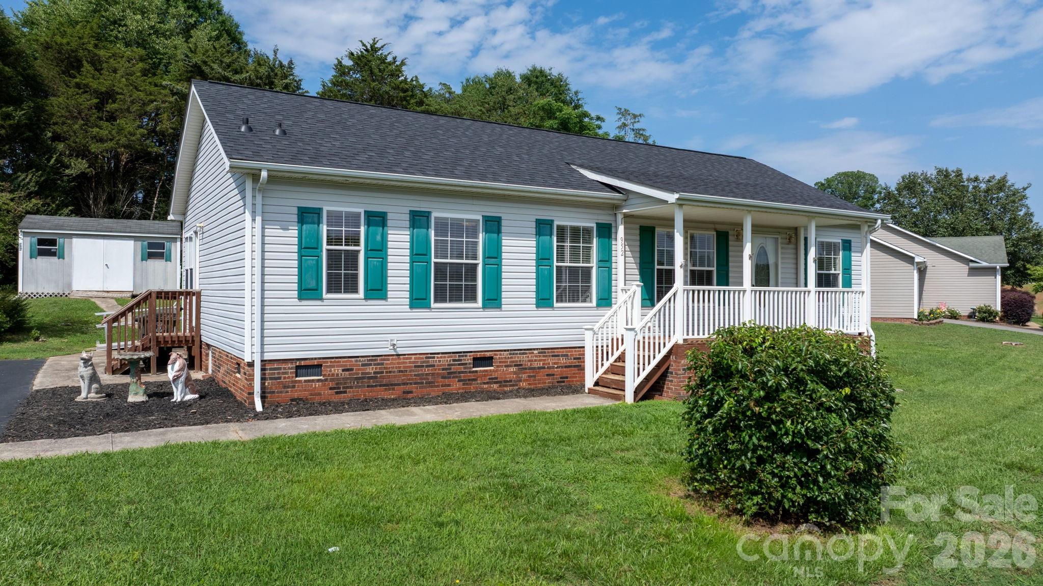 Low-maintenance living in an established Newton neighborhood. This 3-bedroom, 2-bathroom modular home features new luxury vinyl plank flooring throughout, a split-bedroom floor plan, and a spacious primary suite with a walk-in closet and dual vanity bath. The kitchen offers ample cabinet space, a pantry, and a breakfast nook, while French doors off the dining area lead to the rear deck. Additional features include a walk-in laundry room, a covered front porch, an accessibility ramp, and a wired storage building/workshop. Conveniently located near shopping, dining, and everyday amenities.