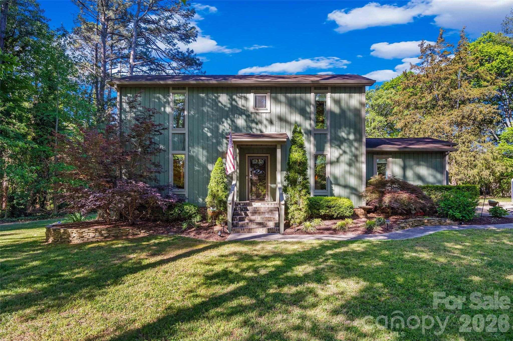 Great Location. Easy Living. Room to Enjoy It All. NO HOA! Welcome home to a property that truly checks the boxes. Nestled in a great quiet location, this home offers the perfect blend of comfort, functionality, and freedom with no city taxes to top it off. Step inside to a welcoming great room featuring a vaulted ceiling and cozy fireplace, creating the perfect space to gather or unwind. Fresh paint throughout gives the home a clean, updated feel, while the upgraded bathrooms add a touch of modern comfort. The primary bedroom on the main level makes everyday living easy and convenient. Out back, you’ll find where this home really shines a level backyard ideal for entertaining, hosting friends, or simply relaxing by the firepit after a long day. The covered back deck is the kind of spot you’ll find yourself using year-round, whether it’s morning coffee or winding down in the evening. And for those who need space to work, create, or store all the toys the huge detached garage/workshop is a rare and valuable bonus. This home offers the kind of lifestyle that’s hard to find space, comfort, and the freedom to enjoy it.