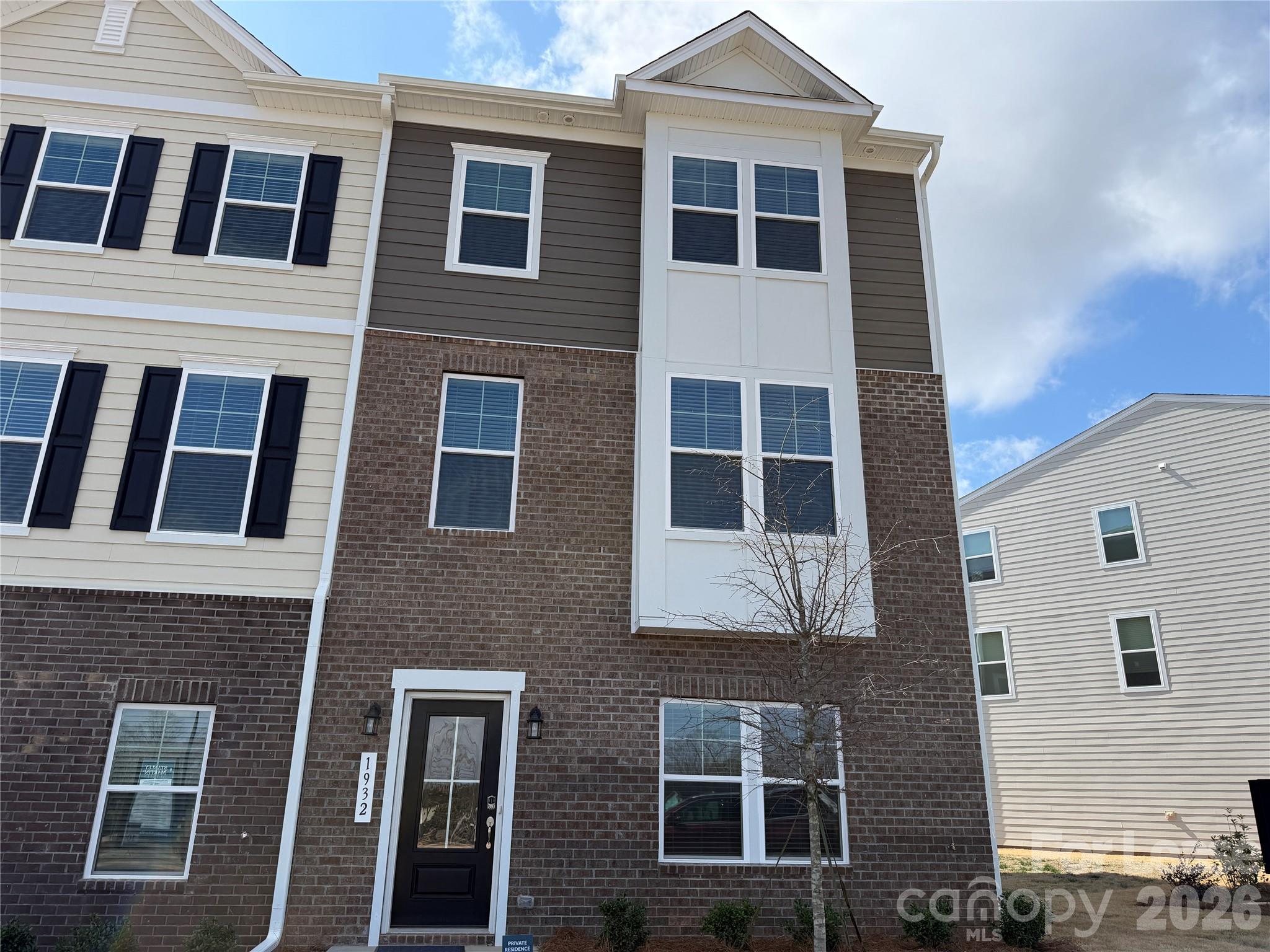 Be the first to live in this stunning end-unit new construction townhome at 1932 Westerhill Drive in the heart of Fort Mill. With 2,164 square feet across three beautifully designed levels, extra natural light from the end-unit location, and a private 2-car garage, this home offers the perfect blend of modern style, comfort, and convenience.

Step inside and you’ll immediately notice the thoughtful layout and high-end upgrades throughout. The lower level features a versatile flex room that can easily serve as a home office, gym, media room, or guest space. It’s flexible space designed to fit your lifestyle.

The main living level is bright, open, and ideal for entertaining. The centerpiece is the expansive chef-style kitchen, featuring a large quartz island, stainless steel appliances, and a sleek vent hood. The open floorplan flows effortlessly into the living and dining areas and leads out to a spacious private deck, perfect for morning coffee or unwinding in the evening.

Upstairs, you’ll find the private bedroom level, including a large primary suite with dual closets and a luxurious bath creating the perfect retreat. Two well-appointed guest bedrooms provide plenty of space for family, guests, or additional workspace. The washer and dryer are already included, making move-in simple and convenient.

The attached 2-car garage adds convenience, security, and extra storage space.

Location is another major highlight. Situated just off I-77 in highly desirable Fort Mill, you’re minutes from Kingsley’s shopping, dining, and entertainment while still enjoying a peaceful neighborhood setting. The home is also located in a highly rated school district.

Property Highlights:
• Brand new construction – never lived in
• Desirable end unit with extra light and privacy
• 3-story townhome with 2,164 sq ft
• Private 2-car garage
• Open concept main living level
• Quartz kitchen island & stainless steel appliances
• Spacious private deck
• Large primary suite with luxury bath
• Two spacious guest bedrooms
• Versatile lower-level flex room
• Washer and dryer included
• Prime Fort Mill location near I-77 and Kingsley

Modern design. Prime location. End-unit privacy. Homes like this don’t stay available long.
Schedule your showing today and experience Fort Mill living at its best.