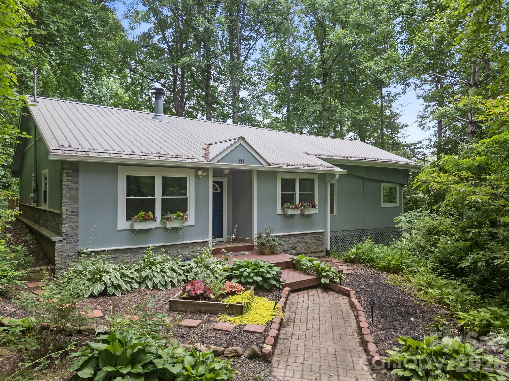BACK ON MARKET through no fault of the home! Previous buyer fell through, giving you a rare second chance at this move-in-ready Mars Hill gem. 

If you’ve been looking for a peaceful, approachable mountain escape without the stress of steep, high-elevation roads or total isolation, this is it. Tucked into a quiet country neighborhood on a private gravel road, 193 Timberside Drive offers the perfect balance: a rustic, relaxed atmosphere with the comfort of neighbors.

The standout feature of this charming 2-bedroom bungalow is the spacious back deck. It’s the ultimate summer spot for evening BBQs, unwinding by twilight, and watching beautiful, colorful sunset glows filter through the trees. Sitting on a manageable 1.07-acre lot with a fenced backyard for pets, the home is incredibly well-equipped with high-speed fiber internet for remote work, a sunroom filled with natural light, and a cozy gas-log fireplace.

Located just 10 minutes from downtown Mars Hill and an easy 30-minute drive to downtown Asheville, minutes from the Appalachian Trail and Max Patch.  This low-maintenance property is an incredible value for a full-time home, a peaceful retirement haven, or a summer vacation rental. Schedule your showing today before it slips away again!