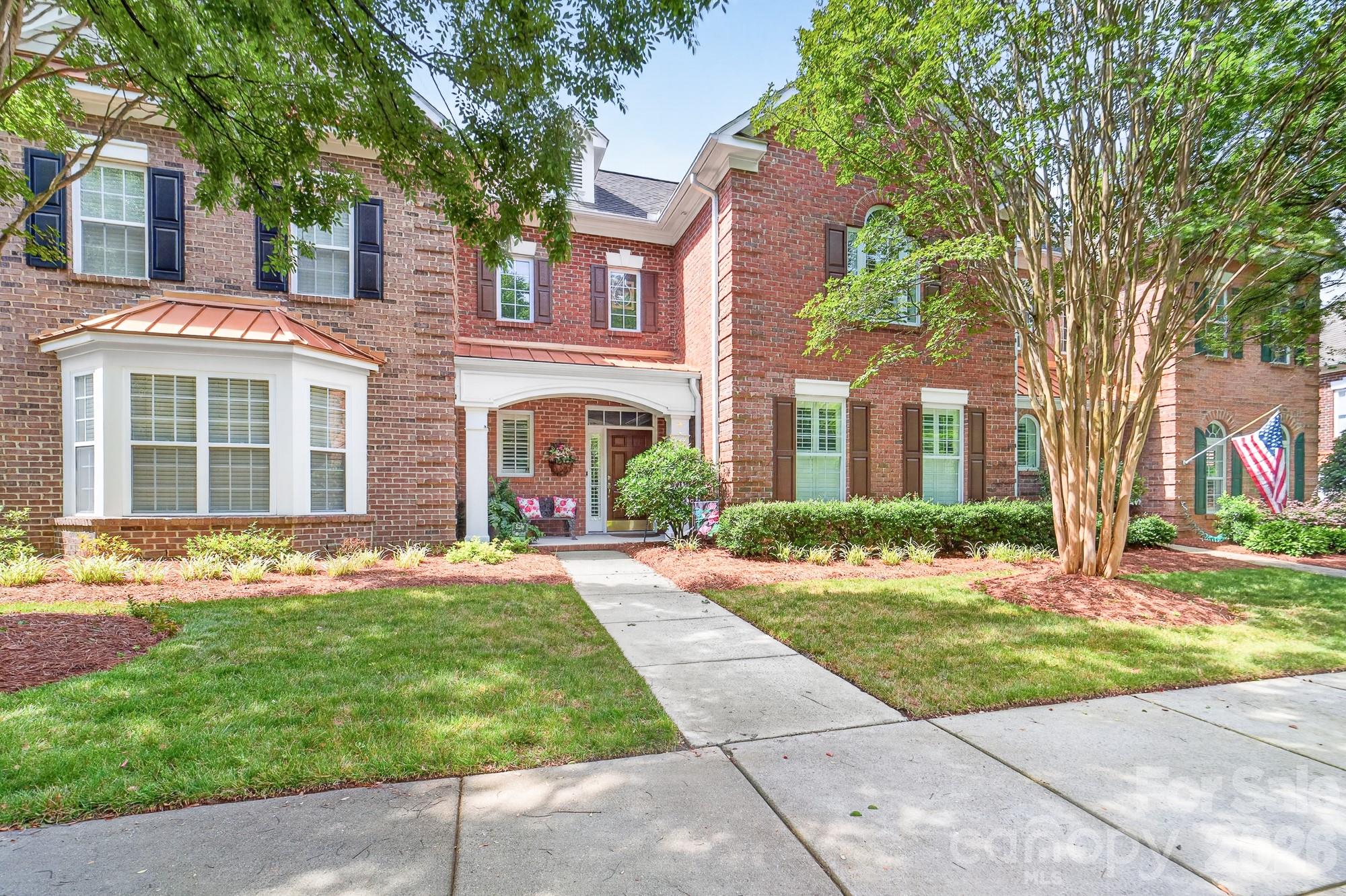 Welcome home to this beautifully appointed townhome in the highly sought-after Hawthorne neighborhood of downtown Belmont.  Ideally located around the corner from Belmont's Main Street, you can easily enjoy many local shops, restaurants, parks, and community events. Designed for both comfort and convenience, this former model home features rich hardwood floors throughout the main living area, a cozy gas log fireplace, elegant plantation shutters, and a desirable primary suite on the main level. The thoughtfully designed floor plan offers spacious living and entertaining areas, complemented by a versatile loft perfect for a home office.  Step outside to enjoy the professionally landscaped private courtyard—an inviting outdoor oasis for relaxing or gathering. Additional highlights include a two-car garage, ample storage, and low-maintenance living in one of Belmont’s most desirable communities.
