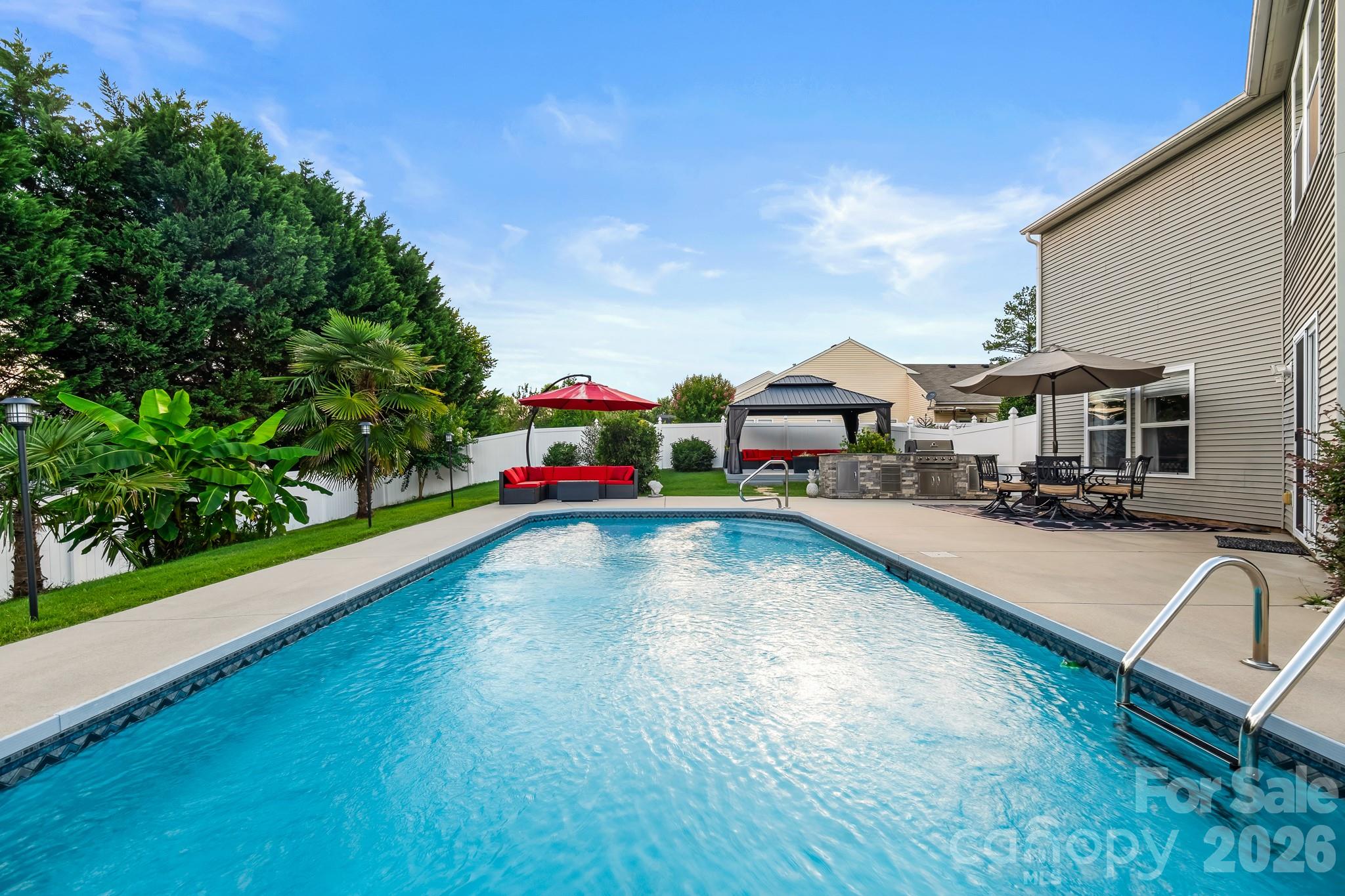 Beautifully renovated home featuring an in-ground salt water pool, set on a private, professionally landscaped lot in Clover. Designed for both everyday comfort and effortless entertaining, the backyard showcases a built-in BBQ area, gazebo, multiple seating spaces, an expansive patio, and mature landscaping that creates a serene retreat perfect for relaxing or hosting guests.

Inside, the home offers new LVP luxury vinyl flooring throughout the main living areas, tile flooring in the kitchen and bathrooms, fresh interior paint, upgraded lighting, and an updated kitchen featuring granite countertops. The bathrooms have been tastefully updated with new vanities, modern countertops, and a custom-tiled shower. Enhanced closet systems provide excellent organization and storage. Major systems—including the roof, HVAC, and water heater—have all been replaced within the past two years for added peace of mind.

Thoughtfully designed outdoor living areas seamlessly extend the home’s interior space, creating an ideal setting for poolside enjoyment, outdoor dining, and gathering with family and friends.

Ideally located in the Clover/Lake Wylie area, close to shopping, dining, parks, and everyday conveniences, and zoned for the highly regarded Clover School District. For buyers seeking a move-in-ready home with stylish updates, a private backyard, resort-style outdoor spaces, and significant system upgrades, this property delivers exceptional value and appeal.
