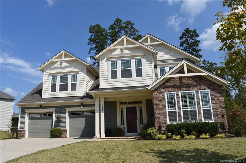 This home located in Shelly Woods neighborhood in Indian Land, SC, near Charlotte, NC, is gorgeous! 4 Bedrooms and 2.5 Bathrooms, 3,347 SF! It has an impressive chef's kitchen with gas cooktop. Master on main, hand-scraped bamboo hardwood floors, Plantation shutters, 5.1 surround sound system & a fenced back yard! This home has been well maintained! It is centrally located in the Shelly Woods neighborhood and backs up to the tree line. The community features pool, pond and playground to enjoy!