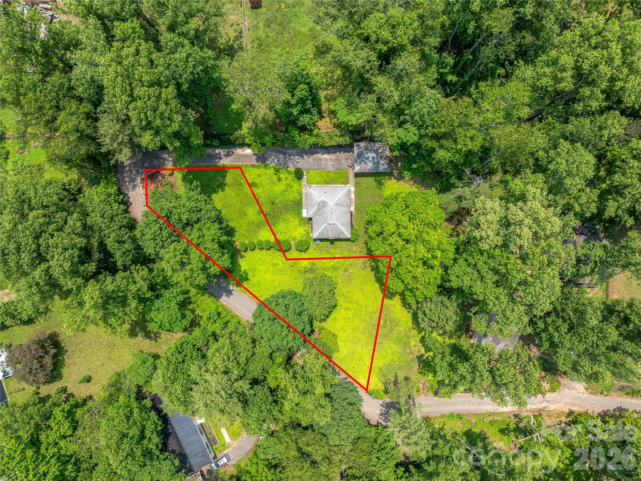Gently sloping 0.24-acre lot in Woodfin with access to city water and sewer—ready for your build! Perfect for a smaller footprint home in a convenient location just minutes from Beaver Lake and 10 minutes to downtown Asheville. The adjacent lot is also listed for sale. A builder familiar with the lot is available for consultation upon request. Don’t miss this opportunity in a growing area!
