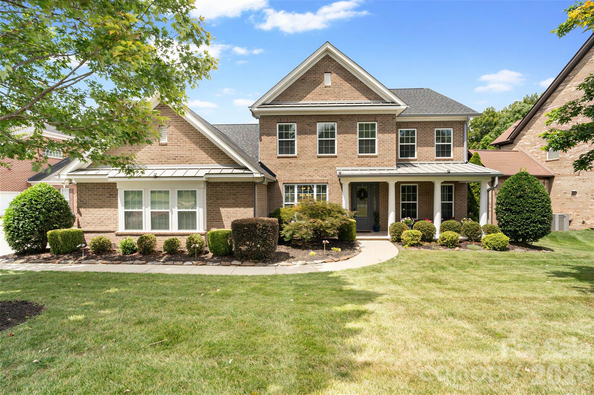 Welcome to one of Weddington Trace’s most beautifully upgraded homes, perfectly positioned on a premier pond lot with fountain views and the community dock just beyond the backyard. This full-brick home offers 3,901 square feet with five bedrooms, including a flexible main-level bedroom currently used as an office, 3.5 baths, a loft, bonus room, extensive walk-in attic storage, and an oversized three-car garage.

The owners have invested extensively in both the beauty and functionality of this home. Recent improvements include a new roof (2025), a new HVAC system with furnace and air conditioning (2026), a redesigned damper system, upgraded 6-inch gutters, professional landscape lighting, and fresh interior paint throughout much of the home.

The chef’s kitchen is a standout, featuring quartzite and leathered quartzite countertops, extensive trim work, generous workspace, and an easy flow for everyday living and entertaining. The countertops continue into the butler’s pantry, which offers additional cabinetry and a separate sink with a water-filtration system. Custom architectural accent walls and quality finishes add warmth and character throughout the home without overwhelming the space. A central vacuum system with two hoses provides added convenience.

The flexible floor plan adapts easily to a variety of needs. The main-level fifth bedroom features French doors and a closet and is currently used as an office, making it equally well suited for working from home or accommodating guests. Upstairs, a spacious loft and bonus room provide additional places to work, relax, or gather, while the bonus room’s full-size closet offers even more versatility. Extensive walk-in attic storage provides plenty of room for seasonal items and keeps the living areas uncluttered.

Step outside and you’ll understand what makes this property so special. The oversized screened porch with EZ Breeze windows overlooks a professionally designed outdoor retreat featuring an expansive paver patio, built-in outdoor kitchen with grill and flat top, fire pit, retaining walls with integrated planters, and panoramic views of the pond, fountain, and community dock. Whether enjoying morning coffee, entertaining friends, or unwinding at the end of the day, this backyard was designed to be enjoyed throughout the year.

The oversized three-car garage features a professionally finished epoxy floor, adding durability and a clean, polished appearance.

Located within the highly desirable Cuthbertson school cluster, Weddington Trace offers exceptional amenities, including a clubhouse, resort-style pool, tennis and pickleball courts, basketball court, scenic ponds, walking trails, and sidewalks throughout the community.

With its major updates already completed, exceptional outdoor spaces, flexible floor plan, and beautiful pond setting, this home is ready for its next owners to move in and enjoy.