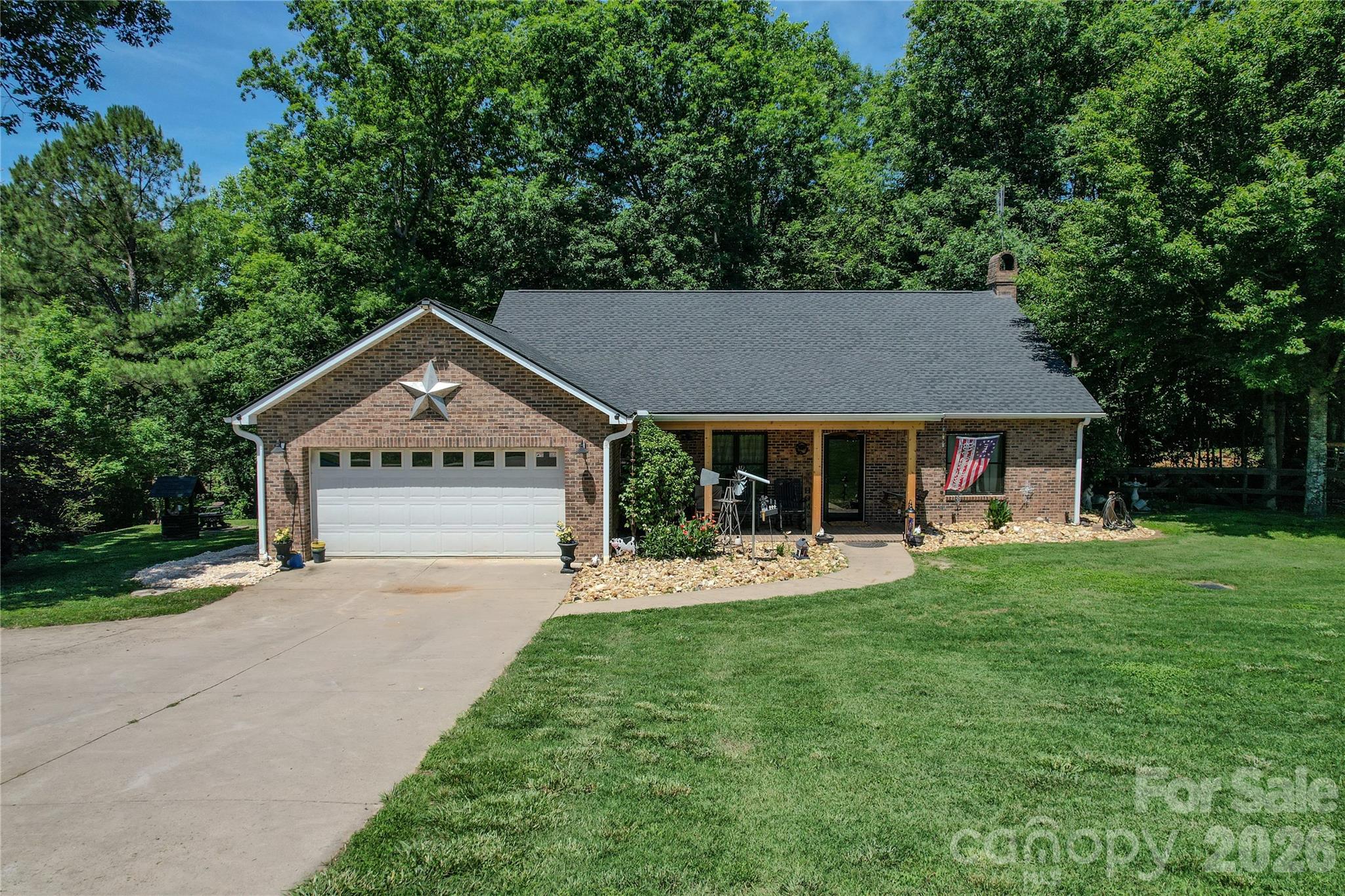 Beautiful brick ranch home situated on ±11.11 acres with approximately 6 acres of fenced pasture currently supporting cattle and sheep, offering the perfect blend of comfortable country living and exceptional functionality. A creek flows through the property, enhancing the beauty and usability of this versatile farm.

The home features granite countertops, updated windows, a spacious primary suite, and a partially finished walkout basement that provides additional living, recreational, or storage space. Enjoy the peaceful setting from the covered rear deck overlooking the wooded portion of the property.

The improvements on this property are truly impressive. A heated and cooled workshop is equipped with a vehicle lift, making it ideal for automotive enthusiasts, equipment maintenance, hobbies, or business use. A whole-home Generac generator system provides added peace of mind and reliability.

Additional improvements include a massive 30’ x 60’ four-bay garage with abundant storage and workspace. The garage is already plumbed for two additional bathrooms and office space, creating endless possibilities for expansion, a home-based business, workshop, or future finished space. A concrete driveway provides convenient access throughout the property and to all improvements.

With fenced pasture, a flowing creek, quality improvements, extensive garage and workshop space, and a well-maintained brick home, this property is well suited for farming, livestock, equipment storage, hobby farming, or anyone seeking room to spread out and enjoy country living. Opportunities to find this combination of acreage, infrastructure, and versatility are increasingly rare.