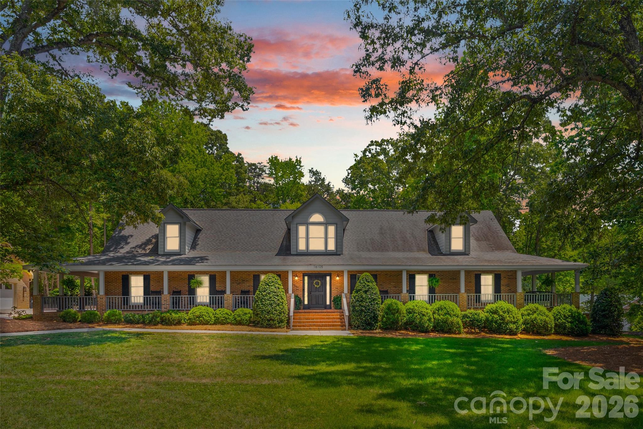 Welcome to 16105 Langston Drive — a truly one-of-a-kind custom-built ranch home perfectly designed for multigenerational living, privacy, and flexibility. Nestled on 3.54 beautifully landscaped acres, this private oasis offers the rare combination of peaceful country-style living with the convenience of Charlotte nearby — all with no HOA restrictions.Designed with comfort and functionality in mind, this spacious home features hardwood floors, oversized bedrooms, and an expansive owner’s retreat creating the perfect private sanctuary. The stunning sunroom overlooks the scenic property and offers an ideal space to relax year-round while enjoying views of the pool and surrounding landscape. A standout feature of the property is the fully equipped in-law suite complete with its own kitchen, two bedrooms, laundry and bath — ideal for extended family, guests, or private living quarters. The single-level ranch layout provides effortless everyday living with no stairs throughout the main home. Outdoor living is equally impressive with a welcoming wrap-around porch, spacious, screened back porch, exterior fireplace, private pool, and poolhouse creating the ultimate retreat for entertaining and relaxing. Surrounded by mature landscaping and peaceful natural beauty, the outdoor spaces provide exceptional privacy and a true retreat-like setting.
For hobbyists, entrepreneurs, or woodworking enthusiasts, the massive 1043 square foot garage and workshop with 521 square feet of storage above provides exceptional space for projects, storage, equipment, or recreational vehicles.
Adding even more value and future potential, the unfinished attic space is already studded with rough electrical in place and offers approximately 1596 additional square feet ready to be customized to fit your needs.
This exceptional property is ideal for buyers seeking privacy, space, workshop functionality, multigenerational flexibility, and resort-style outdoor living — all without the limitations of a restricted community.