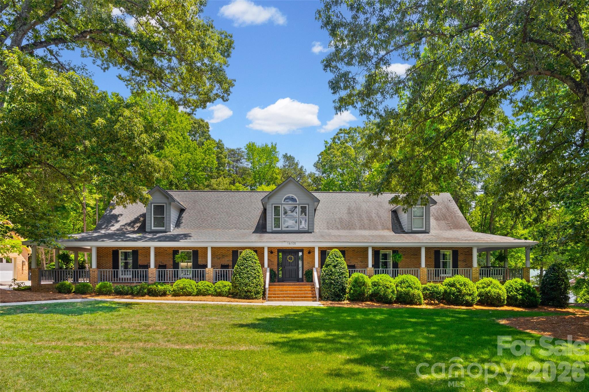 Welcome to 16105 Langston Drive — a truly one-of-a-kind custom-built ranch home perfectly designed for multigenerational living, privacy, and flexibility. Nestled on 3.54 beautifully landscaped acres, this private oasis offers the rare combination of peaceful country-style living with the convenience of Charlotte nearby — all with no HOA restrictions.Designed with comfort and functionality in mind, this spacious home features hardwood floors, oversized bedrooms, and an expansive owner’s retreat creating the perfect private sanctuary. The stunning sunroom overlooks the scenic property and offers an ideal space to relax year-round while enjoying views of the pool and surrounding landscape. A standout feature of the property is the fully equipped in-law suite complete with its own kitchen, two bedrooms, laundry and bath — ideal for extended family, guests, or private living quarters. The single-level ranch layout provides effortless everyday living with no stairs throughout the main home. Outdoor living is equally impressive with a welcoming wrap-around porch, spacious, screened back porch, exterior fireplace, private pool, and poolhouse creating the ultimate retreat for entertaining and relaxing. Surrounded by mature landscaping and peaceful natural beauty, the outdoor spaces provide exceptional privacy and a true retreat-like setting.
For hobbyists, entrepreneurs, or woodworking enthusiasts, the massive 1043 square foot garage and workshop with 521 square feet of storage above provides exceptional space for projects, storage, equipment, or recreational vehicles.
Adding even more value and future potential, the unfinished attic space is already studded with rough electrical in place and offers approximately 1596 additional square feet ready to be customized to fit your needs.
This exceptional property is ideal for buyers seeking privacy, space, workshop functionality, multigenerational flexibility, and resort-style outdoor living — all without the limitations of a restricted community.