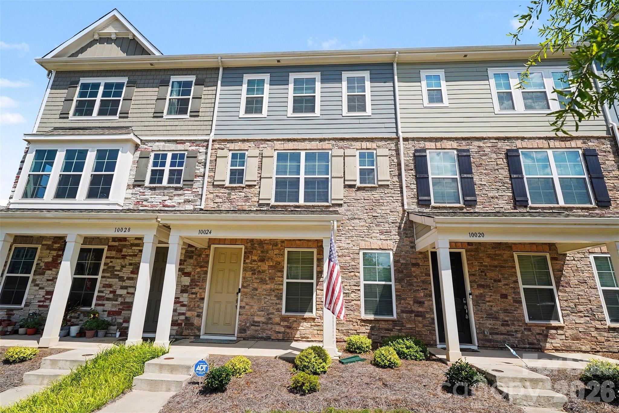 9 ft ceilings all levels | Gourmet kitchen w/ gas range & island | Walk-in Pantry | Fireplace w/ shiplap | Primary suite w/ tray ceilings | High-end Spa-like bathroom w/dual vanity | 6-inch LVP flooring | 2-car rear-load garage | Move-in ready. Located in the heart of Mint Hill, this immaculate townhome puts you within just minutes to uptown dining and shopping and everything else . Inside, an open floorplan and 9-foot ceilings on every level create a bright, airy feel. The kitchen is a standout — granite countertops, stainless steel appliances including a gas range, a large island, white shaker cabinets, and a subway tile backsplash. The living room centers around a fireplace framed by shiplap and a wood mantle. The primary suite offers tray ceilings, an en-suite bath with dual vanity and glass shower, and a spacious walk-in closet. Throughout the living areas you'll find durable LVP flooring, complemented by 2" blinds, a covered front porch, and a 2-car rear-load garage. Truly move-in ready from top to bottom.
