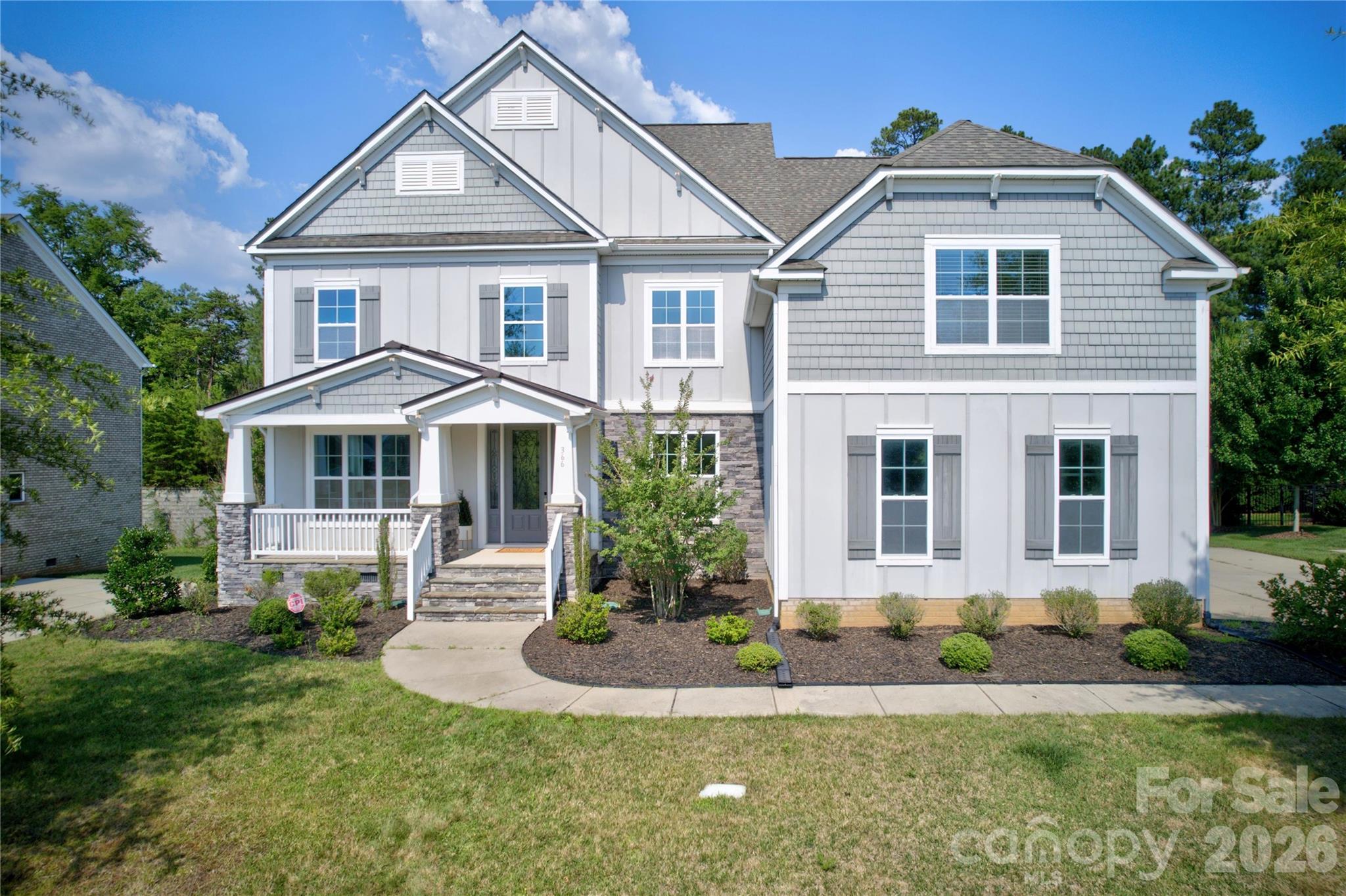 Situated on a premium wooded lot in Fort Mill’s desirable community of Habersham, this custom Shea built 5 bedroom home is move-in ready perfection.  A rocking chair front porch leads to a grand 2-story foyer with formal dining room and flexible study to either side.  A gourmet chef’s kitchen with oversized island with bar top dining features quartz counters, gas cooktop with exterior venting hood, double wall oven and microwave, ample 42” custom cabinets and walk-in pantry.  A convenient breakfast room is off the kitchen.  The natural light filled open concept floor plan allows for the kitchen to flow seamlessly to the great room complete with gas fireplace and built-in shelving.  A convenient guest suite with full bath is located on the main level.  Upstairs an enormous primary suite awaits with private balcony access, huge walk-in closet and spa-like en suite bath complete with custom dual vanity, garden tub and large glass enclosed tile shower.  Bedroom three features a private en suite bath while bedrooms four and five, both generous in size, are connected by Jack n Jill baths with private vanities.  An oversized flexible bonus room is an ideal game or play space.  Venturing outside, a covered deck overlooks the private backyard with raised garden beds.  Conveniently located moments from premier shopping, dining and entertainment with award winning Fort Mill school assignments and wonderful neighborhood amenities including pool, clubhouse, walking trails and private lake with dock, this is a must see!