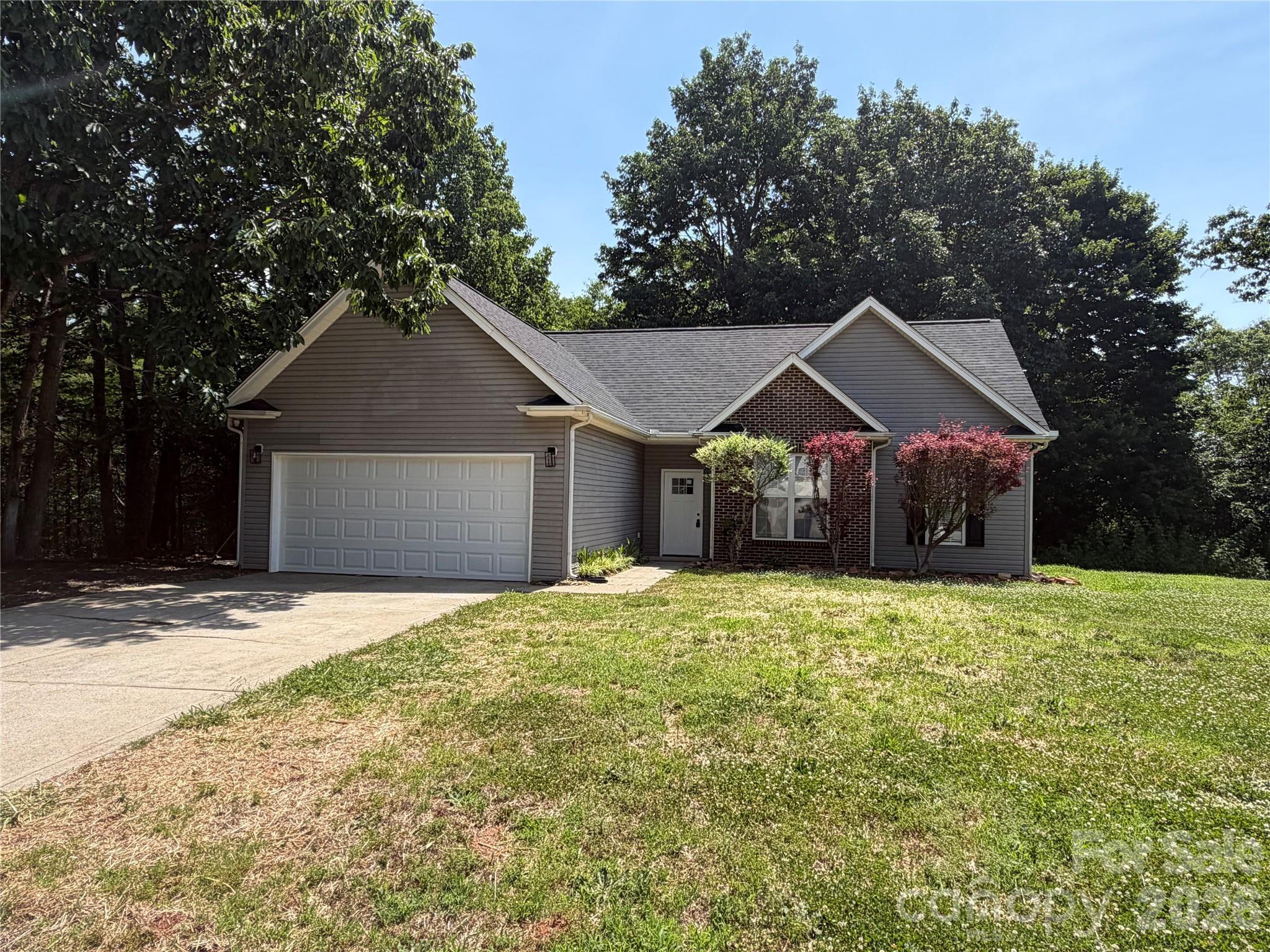 Nice ranch home with attached 2 car garage.  Nice kitchen is open to the family room and features vaulted ceilings.  The kitchen has granite countertops and features an island with a sitting area.  The large private deck off of the family room/kitchen area makes it great for entertaining.   New LVP flooring and fresh neutral paint throughout the home.  This home is in great shape and is has a new roof.  The large two story work shop on the side of the home is sold as is and would make a great workshop or "man cave".  Seller is willing to remove the workshop if desired with an acceptable offer.