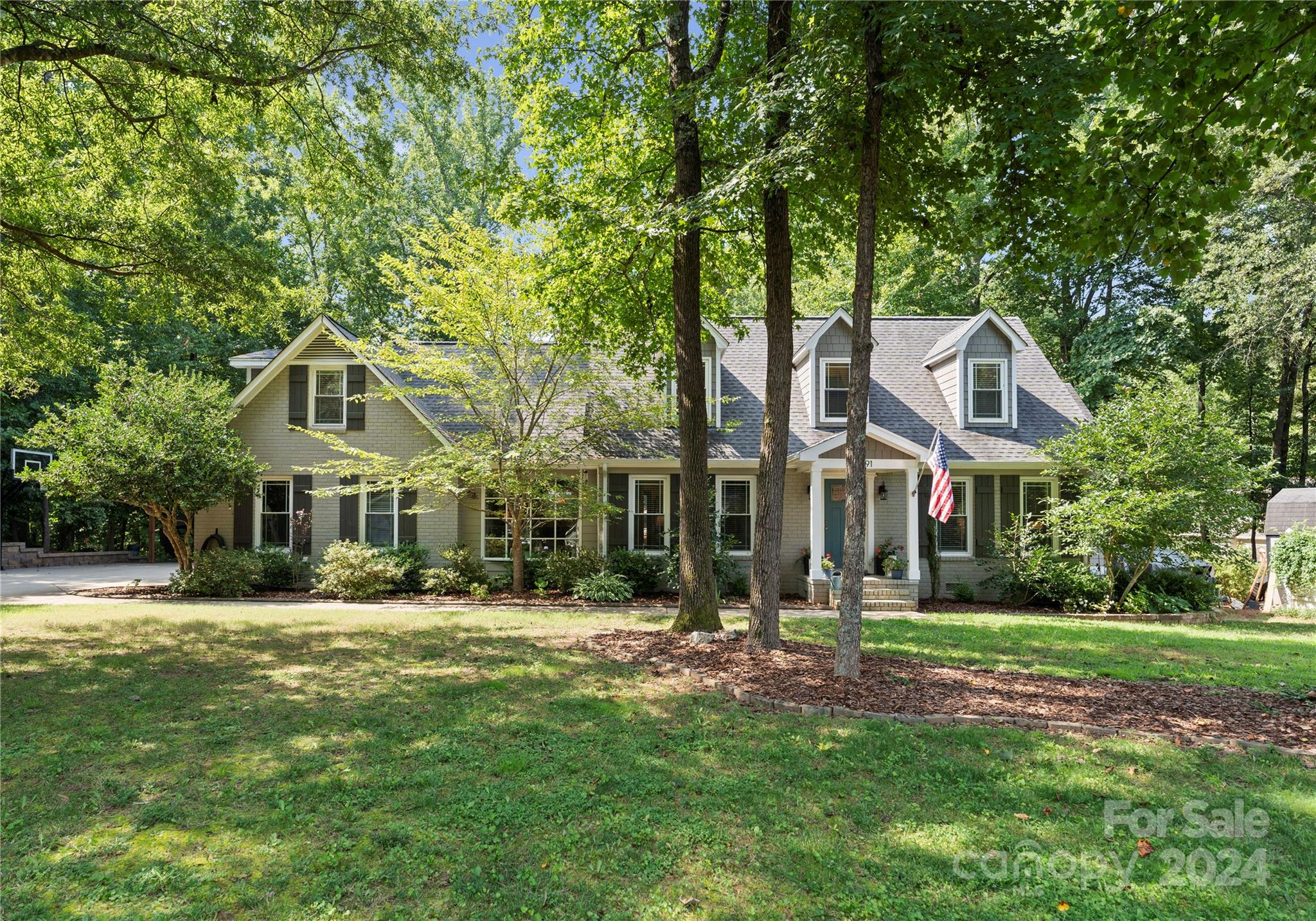 Only 3 MINUTES from downtown Fort Mill, don't miss this rare opportunity to live in Old Orchard, boasting large lots and mature trees. Spacious floorplan w/ a private primary suite on main floor! Hardwood floors downstairs and a huge kitchen w/ lots of cabinet and counterspace that connects to open living room. Right off the living room enters the private primary suite w/ amazing natural lighting, a large custom walk-in closet, and the primary bath w/ double vanities, a 6' tub, and walk-in shower! Additional bdrm downstairs. Upstairs you will find 2 bdrms, 1 full bth, + bonus room w/ skylights that leads to an expansive office space. This home also feature many study nooks throughout the upstairs hallway. Enjoy your private backyard w/ a firepit, large deck, and pool. In addition to a garage, check out the 24x26 steel truss open pole barn, suitable for a camper/RV/ boat, + can easily be enclosed. This home is in an amazing location one of the highest rated school districts in the area.