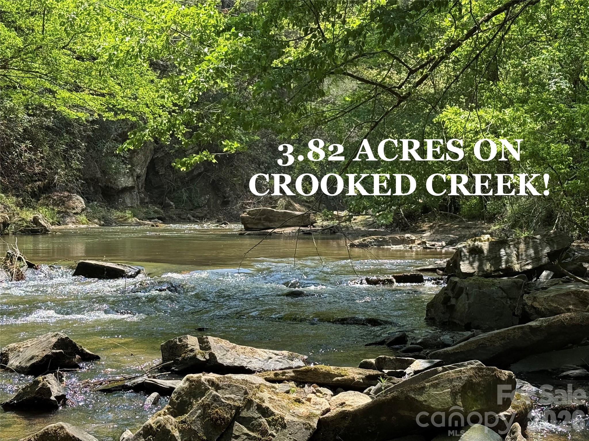 They don't make land like this any more! I am excited to offer up such an exceptional 3.82 ACRE TRACT on one of the most beautiful stretches of CROOKED CREEK! OVER 800 FEET of DIRECT FRONTAGE and with a road right down to the water's edge! Plenty of nice buildable ground that sits out of the reach of floodwaters. The opposite bank of the creek makes for a great view, with a vertical rock face and steep woods. It lends to a very private setting. This side is definitely the one you want though, easily walkable along the entire length of the creek with sandy beeches and areas of beautiful river rock and boulders. It's also hard to beat the location. Only a 5 minute drive to hop on I-40, so you could quickly be in Black Mountain or Asheville to enjoy a tasty dinner out. That is if you ever want to leave. I didn't. I spent way too much time at this place while I was taking pictures, and really wished I had brought a lawn chair to plop down in out in the water. The sound of a rushing creek just soothes the soul. Check out the video to hear it for yourself. Power is on site, and this place is ready to be enjoyed, so get out and take a look. You'll be hard pressed to find anything like it. It truly is a gem!