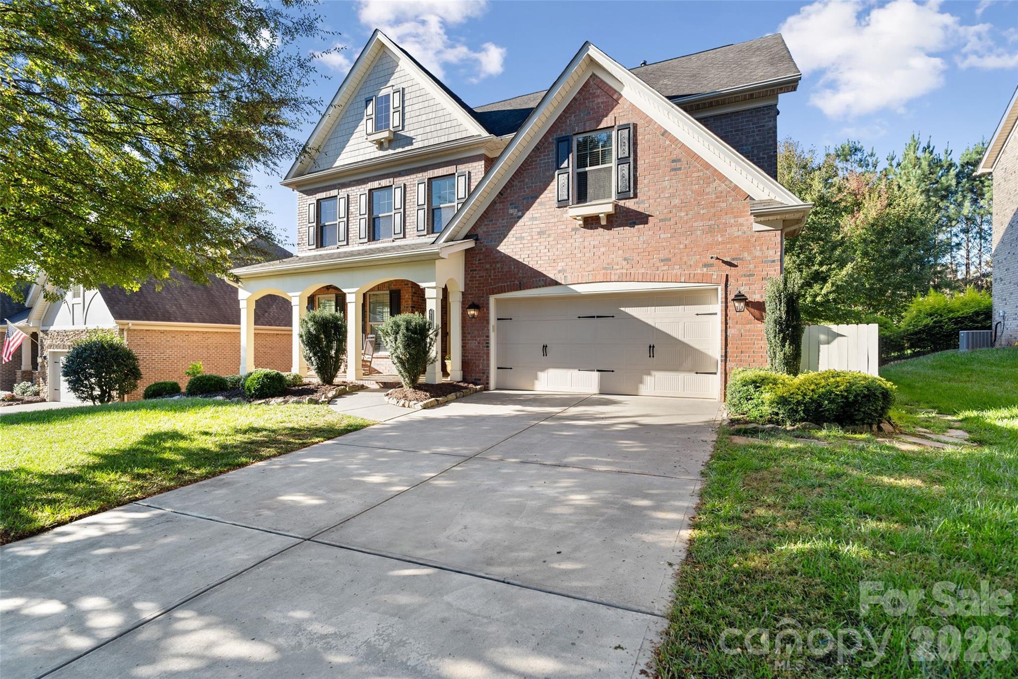 Beautifully updated with standout outdoor living in sought-after Barber Rock! The light-filled main level features hardwood floors throughout, a soft neutral palette, and elevated trim details including plantation shutters, crown molding, wainscoting, and arched doorways. The kitchen shines with a statement island featuring a custom bar-seating cutout, stainless steel appliances, gas range, tile backsplash, and a walk-in pantry with custom shelving. A dedicated office offers a comfortable and quiet work-from-home space. Upstairs, the spacious primary suite is a true retreat, complete with a large walk-in closet outfitted with a custom organization system. Step outside to enjoy a flat, private backyard with garden beds and a stamped concrete patio—perfect for hosting, unwinding, or enjoying outdoor meals. A covered porch adds another inviting space to relax year-round. Ideally located between Indian Land, Ballantyne, and Fort Mill, Barber Rock offers top-tier amenities and easy access to top-rated schools, shopping, dining, and all the best of the surrounding area.