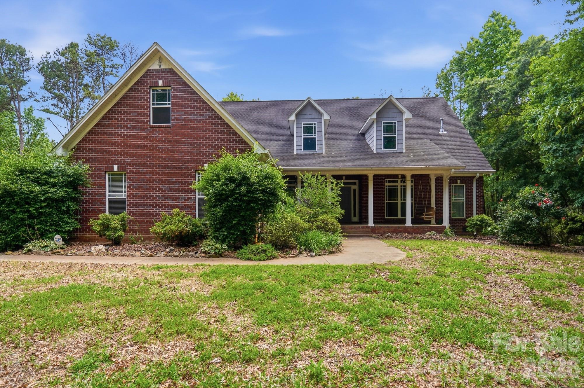 Escape to privacy and comfort in this beautifully maintained 4-bedroom, 2-bath brick home set on 13 serene acres. Surrounded by mature woods, this property balances peaceful seclusion with space to explore and enjoy.

Inside, you’ll find gleaming hardwood floors, a bright, open layout, and new stainless steel kitchen appliances. Step out to the screened-in porch or unwind under the pergola on the deck, perfect for morning coffee or evening gatherings. The unfinished walk-in attic space can be used for storage or made into a game room or bonus room. There are endless possibilities. 

Modern upgrades include solar panels, a self-heating carbon filtration system, Leaf Guard gutters, and a generator hookup—providing both efficiency and ease of living. Whether you’re looking for a private retreat or a place to spread out and entertain, this unique property combines timeless craftsmanship with smart sustainability.

A rare find—private, practical, and ready to welcome you home.
