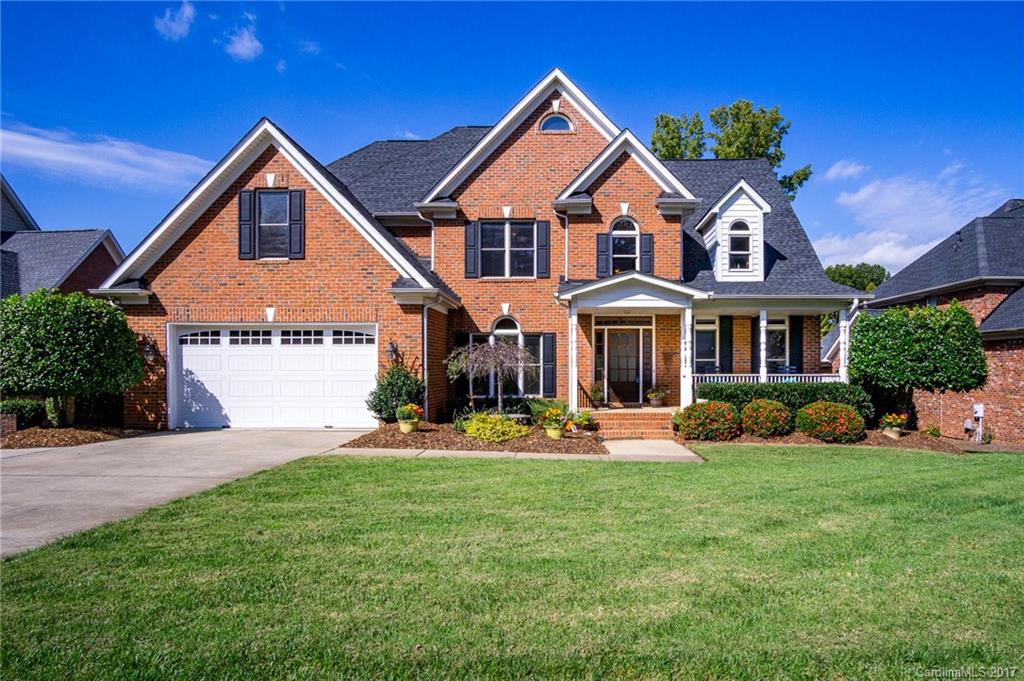 Stunning full brick custom home! Enjoy the water views from the deck, kitchen, 2-story great room, & master bedroom. Gourmet kitchen with glazed maple cabinets, stainless appliances, gas cooktop, double ovens. Hardwoods in main living areas & new paint! Finished basement features additional bedroom/office, full bath, large rec room, exercise area & tons of storage. 3 HVAC units, tankless W/H. Beautifully landscaped & private dock with access to lake for kayaking/canoeing, or paddle boating.