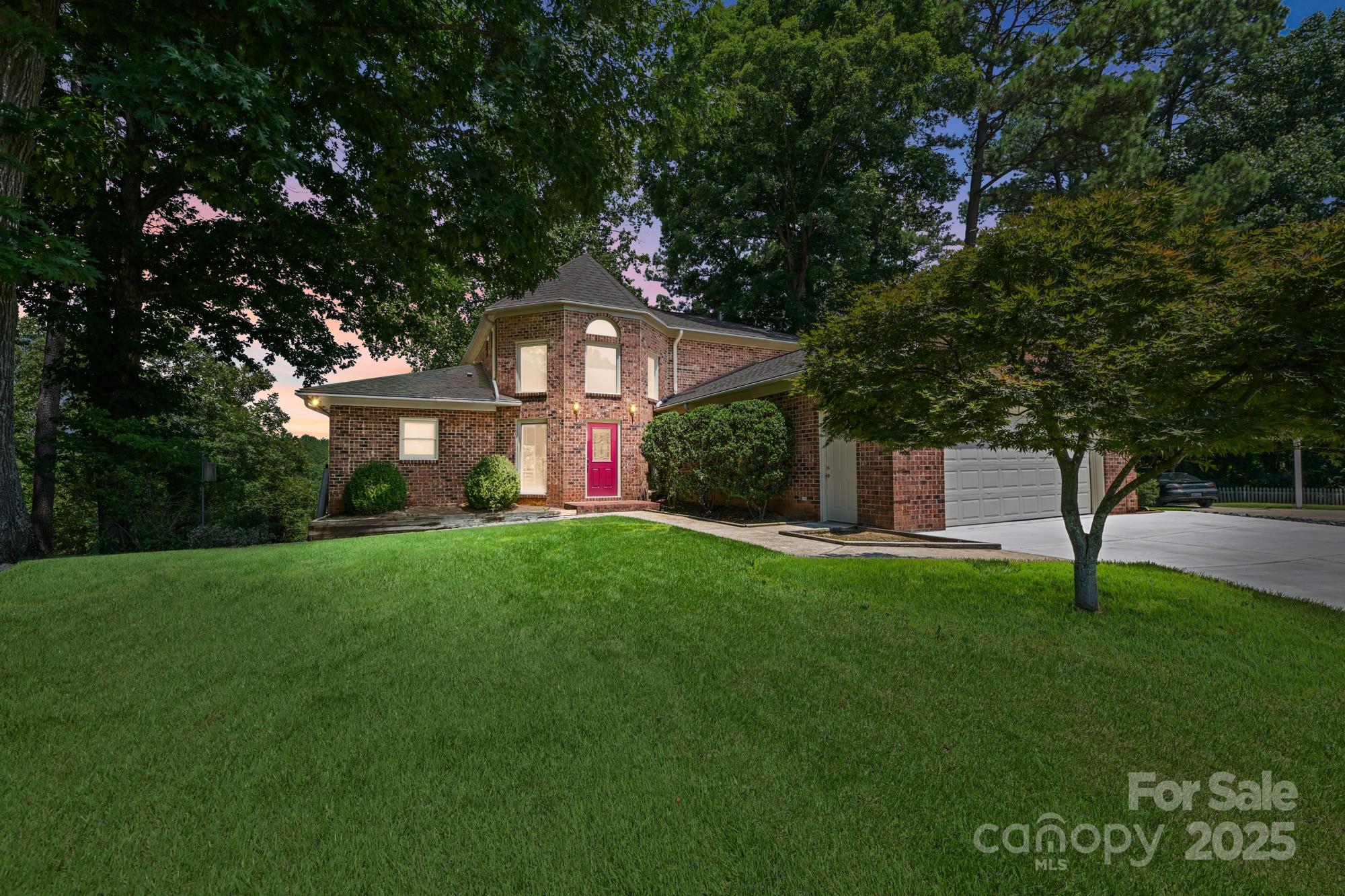 An extremely clean & beautifully maintained full brick home that promises MUCH more than just a place to live. Meticulously cared for, this home offers a lifestyle of comfort, elegance & water views. When walking into the foyer with soaring ceilings & an immediate sense of openness & tons of natural light. The living room, with its floor to ceiling wall of windows allows a bright & airy feel along with amazing views! The primary bedroom is on the main floor, with a spacious ensuite bath & walk in closet. Two additional bedrooms & a full bathroom upstairs is perfect for family or guests. The laundry chute adds convenience. The fully finished walkout lower level is designed for versatility, featuring a bedroom, bathroom & additional living / flex space. Situated at the back of a quiet cove of Lake Wylie, enjoy peaceful water views while located at the end of a private cul de sac lot. Please note that this property does not accommodate a boat dock. Home is IMMACULATE - BRING OFFERS!!