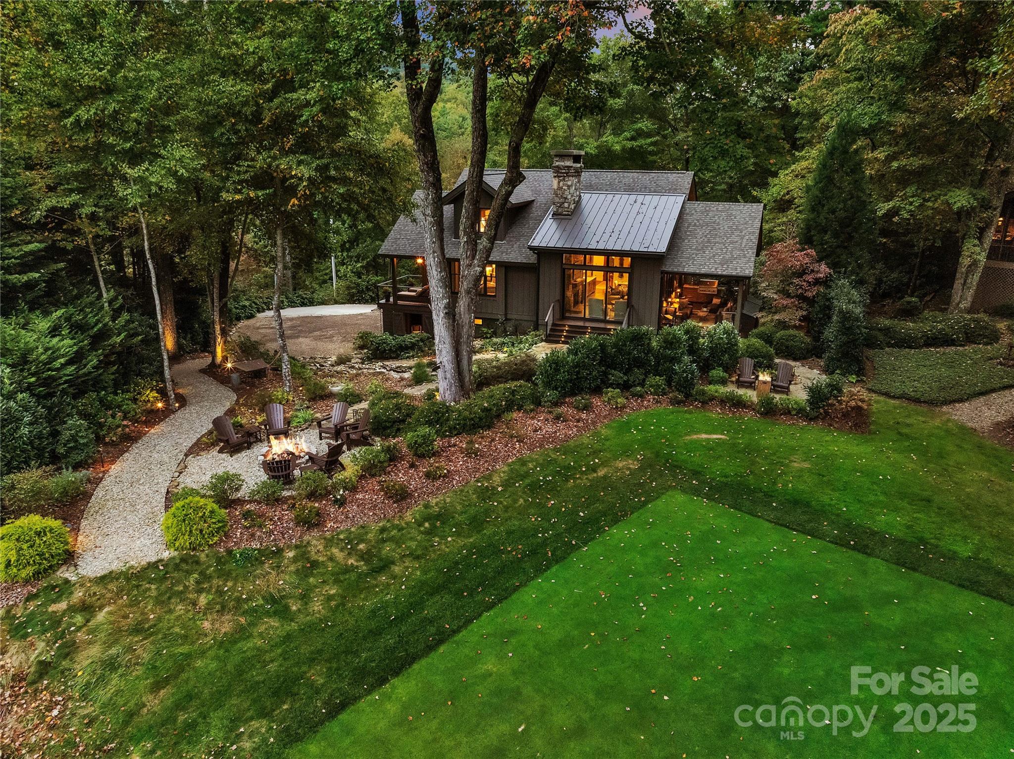 This masterfully created 3BR/3BA home fondly known as Falls View Cottage was designed by celebrated architect Al Platt with interior design by noted Charlotte designer. Situated behind the signature #4 tee box of LTCC with a full view of Toxaway Mountain and year-round view of a massive waterfall, this home is offered turn-key furnished with many impeccable features including a Great Room with a two-story vaulted ceiling and a massive wood-burning stone fireplace and large bar, chef's kitchen with stainless steel appliances, beautifully appointed master suite w/ private covered porch overlooking Lake Cardinal and Panther Tail Mountain, Master BA w/ stunning zinc/cast iron tub, separate vanities, marble enclosed steam shower, heated floors, and large closet, additional main level BR and full BA, upper-level magazine quality bunk room w/ full bath and, and full additional guest quarters in the lower level w/ private access.
