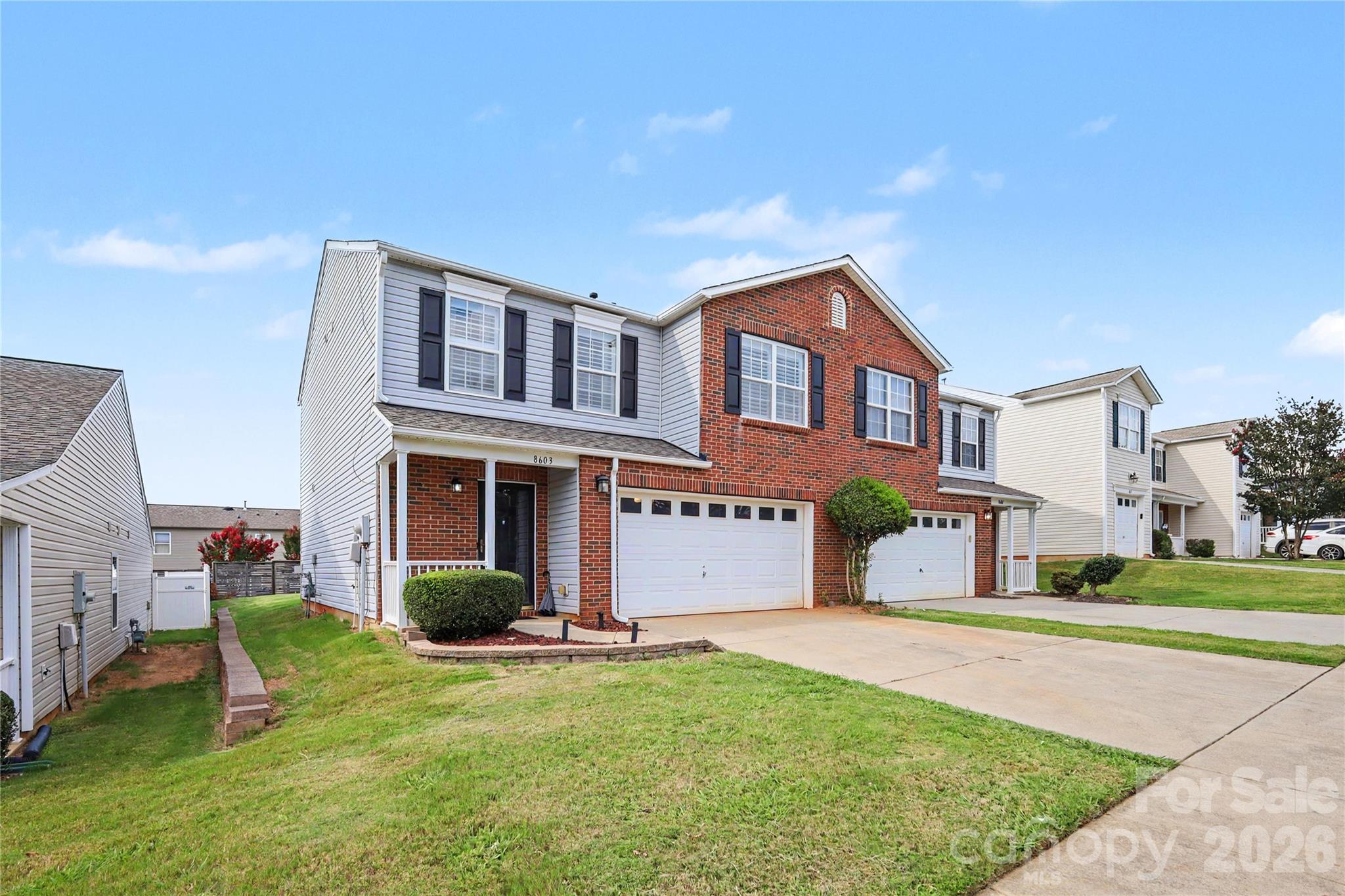 End-unit townhome in McIntyre offers 2 bedrooms, 2.5 bathrooms, and 1,667 sqft of comfortable living. Freshly updated flooring upstairs, paint throughout, kitchen cabinets and a new roof in 2023! Spacious layout features open living area with gas fireplace, tons of natural light, and a bright kitchen with pantry and stainless steel appliances! Upstairs boasts roomy bedrooms including a primary suite with garden tub, walk-in closet, and dual sinks. Laundry is conveniently located on the upper level. Outdoor perks include a front porch, back patio, and large backyard. Attached 2-car garage adds extra storage and convenience. Community amenities: pool, dog park, picnic area, sidewalks & playground. Easy access to I-485, shopping, and more! This well-maintained home is move-in ready—don’t miss your chance to own this gem!