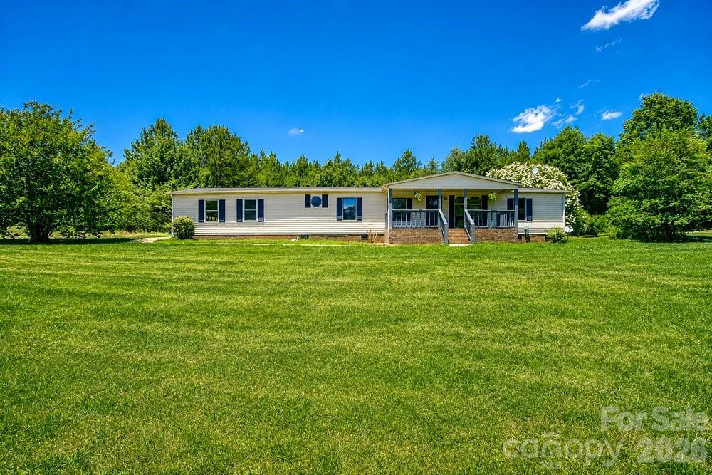 This charming 3-bedroom, 2.5-bath home offers plenty of space inside and out, situated on 1.09 acres. The property features an attached 2-car garage, a large deck perfect for entertaining, and two outbuildings one smaller storage building and a large all-metal building with endless possibilities.

Inside, you'll find fresh paint throughout, new laminate wood flooring, and beautiful LVP flooring in the bathrooms. The updated kitchen showcases new cabinets, countertops, and stainless steel appliances.

The spacious primary suite offers a beautiful bathroom complete with a double vanity, soaking tub, and separate walk-in shower giving you the best of both worlds.

If you're looking for an affordable home with land, storage, and modern updates, this property is a must-see! Schedule your showing today.
