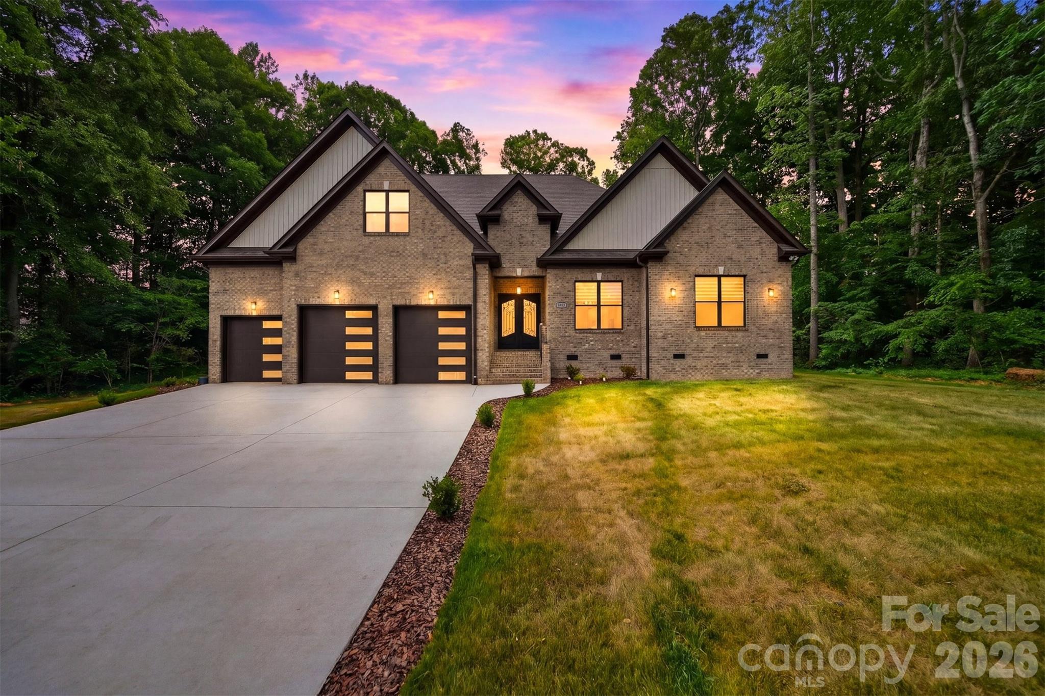 Experience everyday living that feels like a luxury getaway in this stunning newly built 2026 home located inside the prestigious Rock Barn Country Club & Spa community. Perfectly positioned just minutes from I-40 and Hwy 16, this 4-bedroom, 4-bathroom showpiece offers over 3,300 sq ft of upscale living with the perfect blend of elegance, comfort, and modern design. From the soaring 10-foot ceilings and oversized 8-foot doors to the wide-open floor plan and designer finishes throughout, every detail was thoughtfully crafted to impress. The chef’s kitchen is a dream with custom cabinetry, Calacatta quartz countertops, premium appliances, induction cooktop, built-in oven/microwave combo, and an oversized walk-in pantry made for entertaining and everyday convenience. The luxurious primary suite feels like a private spa retreat with a freestanding soaking tub, tile shower, dual vanities, and spacious walk-in closet, while every bedroom in the home features its own walk-in closet for exceptional storage. Upstairs offers additional bedrooms, bonus space, upgraded attic storage, and room for everyone to spread out. Enjoy extras like a dining room minibar with beverage fridge, ethernet wiring, epoxy garage floors, main-level laundry, and a 3-car garage with a dedicated bay perfect for your golf cart or weekend sports car (smaller than the double bay). With optional access to championship golf, resort-style pools, tennis, fitness center, spa, and clubhouse amenities, this home delivers the lifestyle buyers dream about.