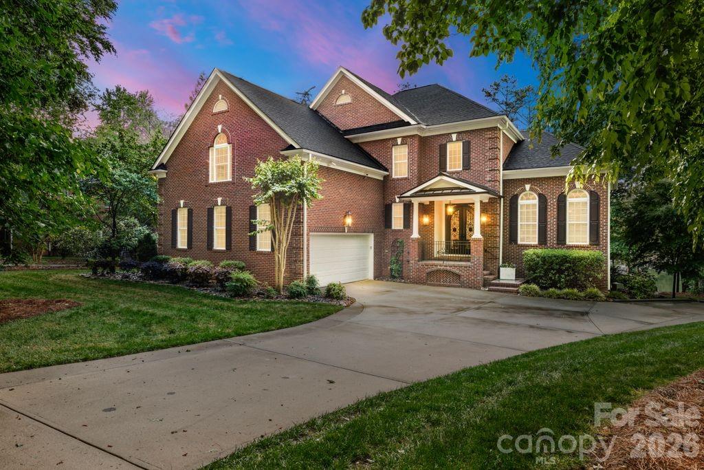 Experience elevated lakefront living in Denver’s premier Sailview community! Situated on an exclusive lot with 76 feet of private shoreline, this exceptional waterfront property features a deep-water pier designed for both convenience and entertainment. The composite-decked dock includes a fixed pier, boat lift, WiFi access, Sonos sound system, motorized automatic touchless boat cover with remote, and remote-powered jet ski lift, everything you need for effortless days on the water. Enjoy your own private sandy beach and firepit, the perfect setting for sunset gatherings by the water. The backyard is a true entertainer’s retreat with a stunning two-level terrace highlighted by a new patio (2019), composite decking, and a dramatic double-sided stone fireplace. Relax year-round in the Bull Frog A9 spa, enjoy two gas heaters for cooler evenings, and take advantage of the outdoor shower after lake days. Additional exterior features include in-ground irrigation pumped directly from the lake, a 10x10 storage shed, landscape lighting, and a tranquil water fountain. The extended private driveway creates an impressive approach to the home while enhancing privacy, and the additional parking pad offers convenient space for extra vehicles, entertaining, or everyday flexibility.  Inside, a soaring 19-foot foyer ceiling makes an unforgettable first impression, with 12-foot ceilings throughout the dining and living rooms enhancing the open, airy feel. Hardwood floors were refinished in 2019 with a rich walnut stain. The kitchen showcases painted cabinetry and island, granite countertops, KitchenAid appliances, and a sunny breakfast nook framed by a wall of windows overlooking the lake. The great room features a gas log fireplace with custom built-ins, while a beautifully appointed sunroom (completed in 2019) offers a floor-to-ceiling stone fireplace topped with a reclaimed wood mantel. The main level also includes a secondary bedroom with full bath and a spacious laundry room with cabinetry and ample storage. Upstairs, the primary suite provides a private retreat alongside two additional bedrooms and an expansive bonus room with built-in desks, custom bench seating, and durable vinyl plank flooring. The finished basement expands the living space with an office or fifth bedroom, full bath, kitchenette, sitting room, recreation area with included pool table, media room, and abundant storage. Residents of Sailview enjoy access to a community pool, pickleball and tennis courts, clubhouse, and year-round social event, offering not just a home, but a lifestyle.