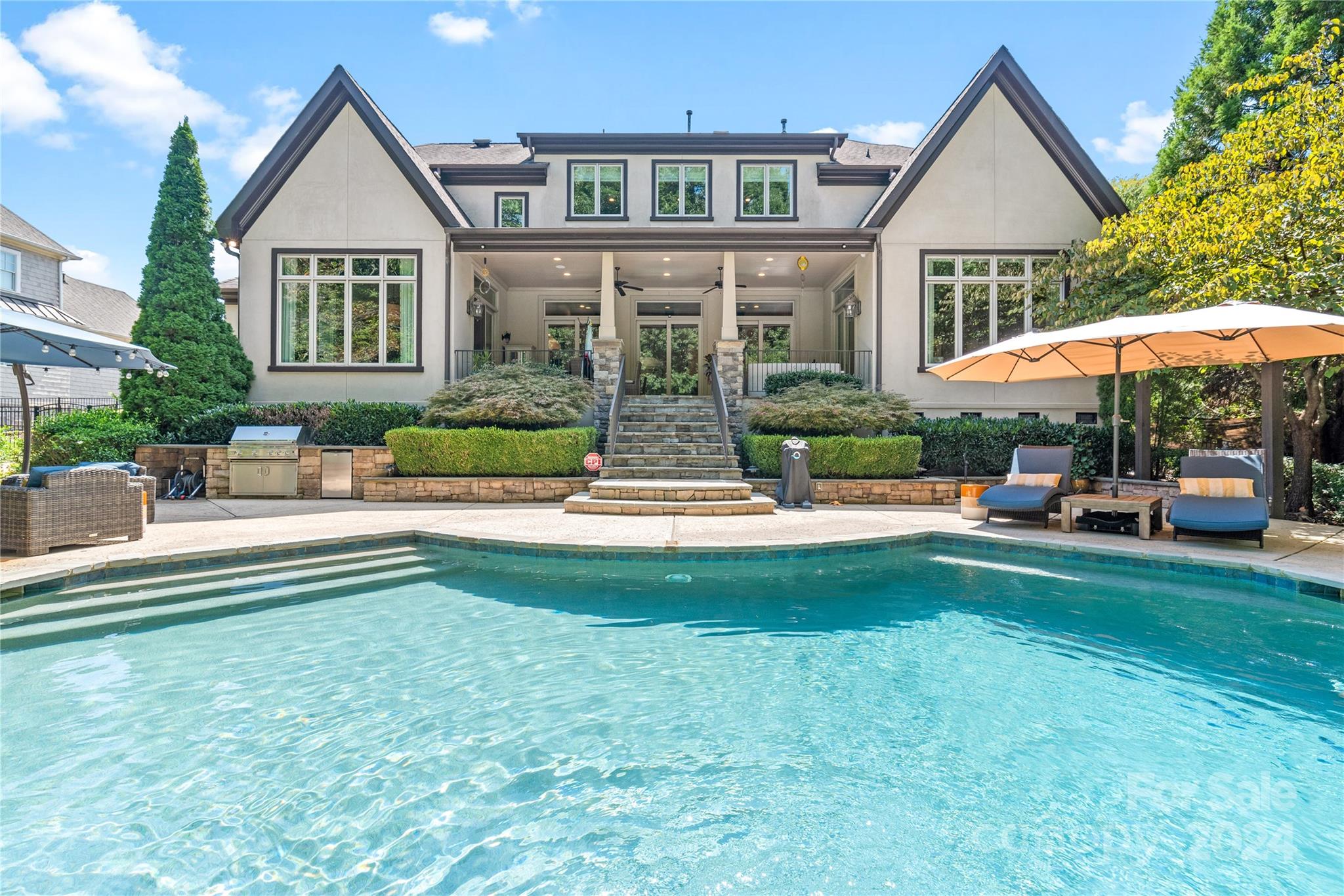 Welcome to Highgate, a highly sought-after luxury neighborhood located over the Union County line. This luxury custom-built 2008 masterpiece is a testament to exquisite craftsmanship & luxury finishes. This 5 bed, 6 bath residence spans nearly 7,000 square feet of opulent living space. Designed with a functional open floor plan offering high ceilings and an abundance of natural sunlight. Chef's kitchen equipped with top-of-the-line Wolf, Subzero, and Bosch appliances, a large pantry & command center. Expansive main level primary bedroom  is a haven of relaxation, complete with spa bath & dual closets. Upstairs offers 4 bedrooms with en-suite bathrooms, a media room with built-in bar, study room and dual stairs. 5 sliding glass doors seamlessly connect the main living area to the covered patio, offering the perfect blend of indoor and outdoor living with heated saltwater pool, gas fireplace, outdoor grill/kitchen. The discerning eye will appreciate the meticulous attention to detail.