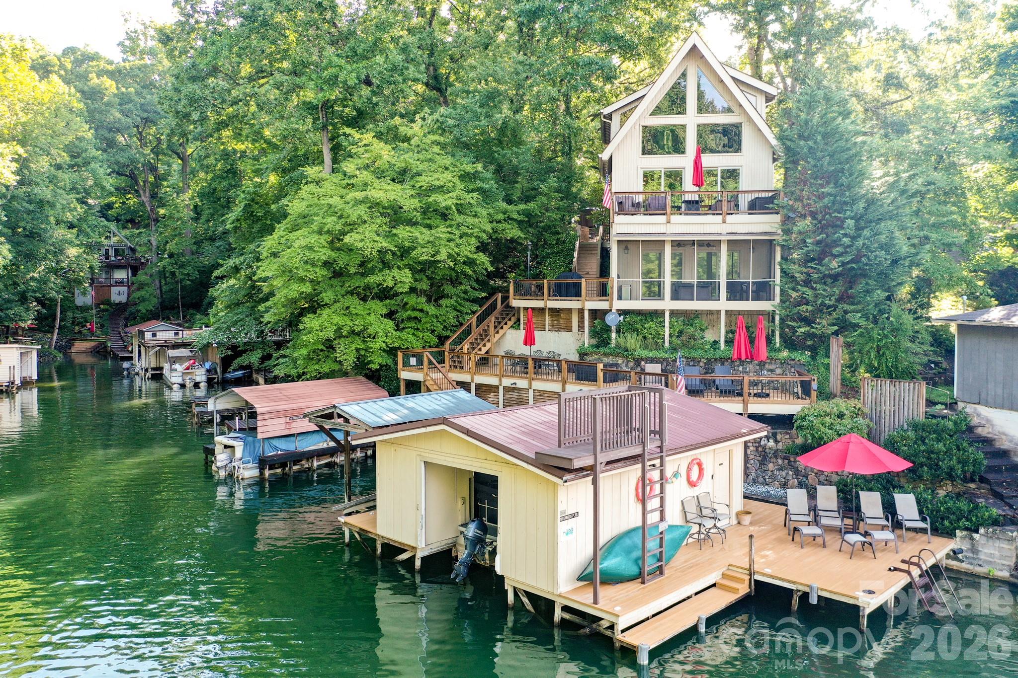 LAKE LURE LAKEFRONT HOME WITH BEAUTIFUL MOUNTAIN VIEWS! This 3 bedroom, 2 1/2 bath, home is situated right at lakes-edge and offers an abundance of lake-side enjoyment with its many decks, porches and docks and is situated just off the main body of the lake, which creates a wonderful safe swim area away from boat traffic. Whether you are looking for a family retreat or a vacation rental property, this home is a must see at $1,495,000.