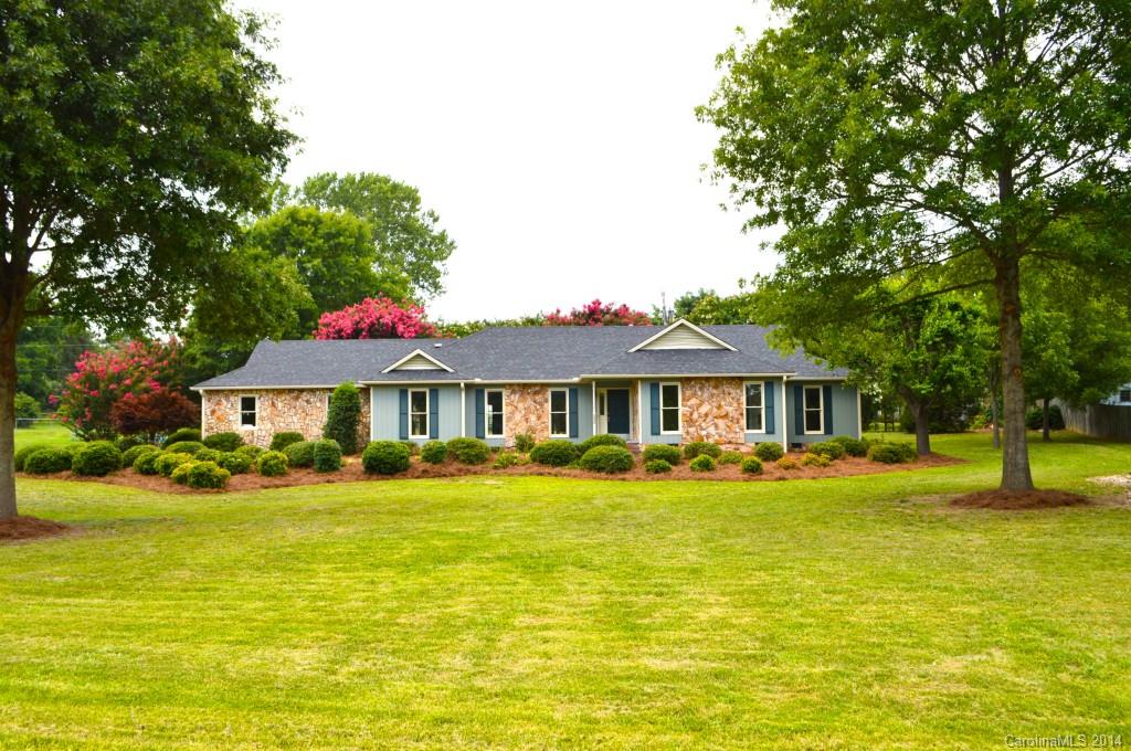Refurbished ranch home on large flat lot.  Great location, quiet neighborhood.  4 large bedrooms with walk in closets.  Updated bathrooms/vanities with a new tile shower in the Master bath.  Updated kitchen with new granite, backsplash and SS appliances.  Beautiful 5" wide hickory wood floors, new stainmaster carpet and paint throughout. Workspace in garage. NEW ROOF, A/C UNIT & HW HEATER. Turn key ready. Seller to offer $400 for home warranty. NO HOA FEES. Located in the county/no city tax.