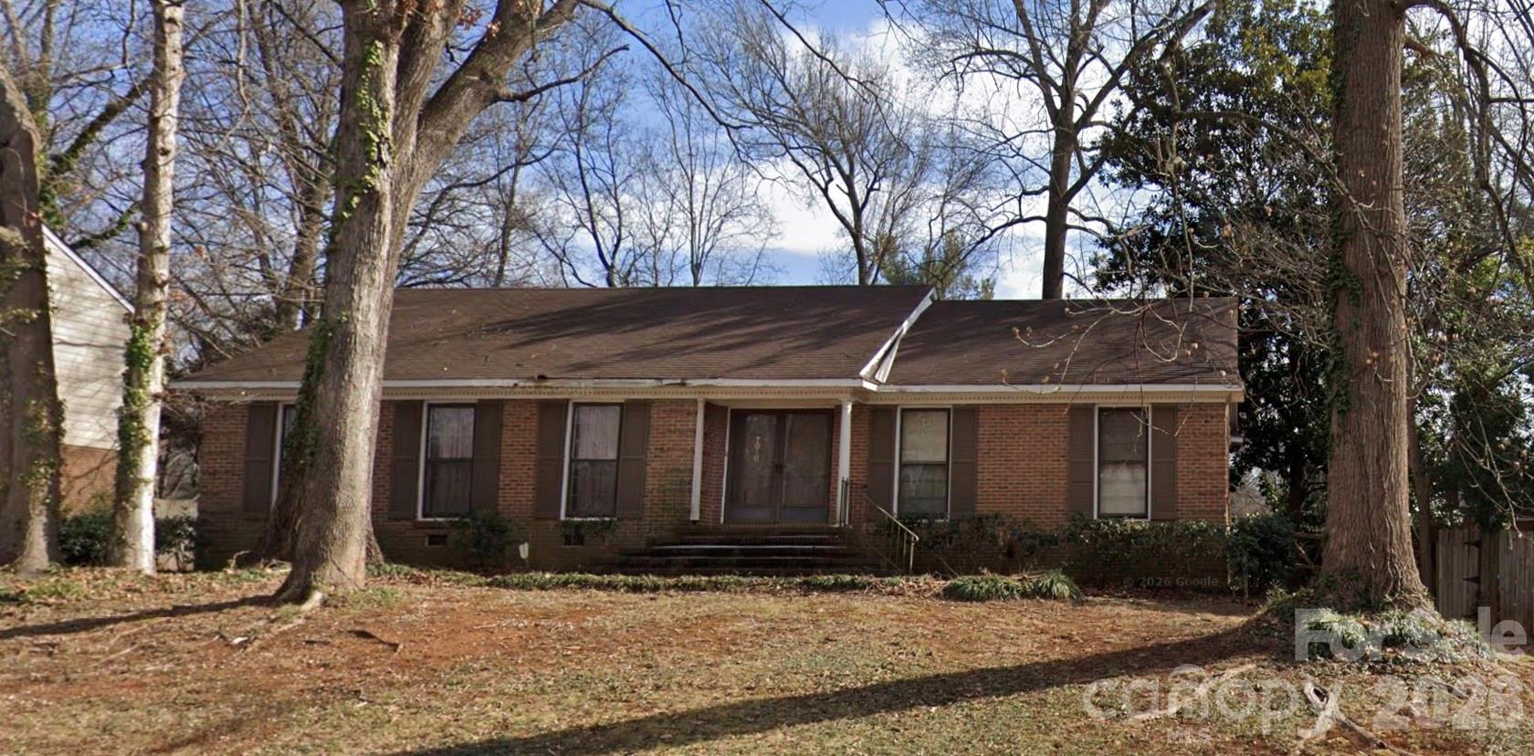 Welcome to this spacious full-brick ranch home located in an established Charlotte neighborhood! Offering approximately 1,650 square feet of living space, this 3-bedroom, 2-bath home combines charm, functionality, and convenience. Inside, you'll find original hardwood floors throughout most of the home, an inviting wood-burning fireplace with insert and blower, and an updated kitchen and main bathroom. The thoughtful floor plan has been enhanced to create a more open feel between the living spaces, making the home ideal for both everyday living and entertaining.

The home also features a heat pump system less than 10 years old, an upgraded 200-amp electrical panel, and all major appliances including refrigerator, dishwasher, washer, and dryer convey with the property. Step outside to enjoy a concrete patio area and a spacious 13x30 storage building with power, offering excellent flexibility for storage, hobbies, or workspace needs.

Conveniently located near shopping, dining, entertainment, and major highways including I-85 and I-485, this property offers comfort, convenience, and opportunity all in one. Seller is offering a 1-year home warranty for added peace of mind. Property is being sold in present condition, and seller has elected not to make repairs.