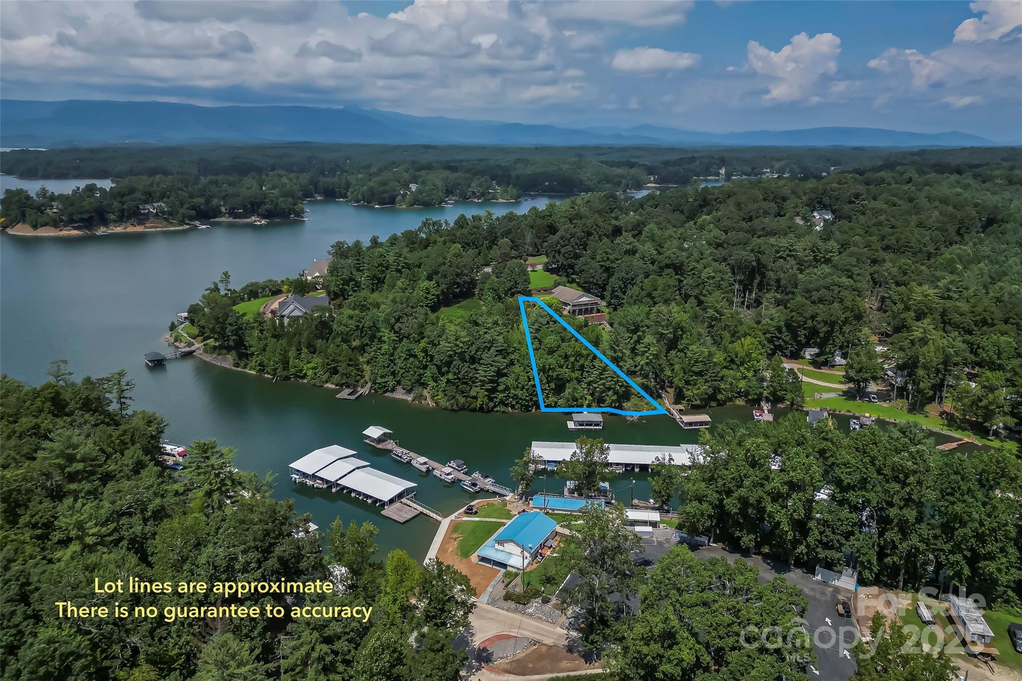Don't just buy a vacant lot on Lake James-buy this waterfront property that has a covered aluminum dock for your boat already in place.  Located in the East shores community with a culdesac location perfect for your Lake home.  The lot has been cleared and is ready to be built on.  Location adjacent to the Mimosa Marina so getting gas for your boat is a breeze.  No wake cove is perfect for swimming or floating and its just seconds out to the main channel for fishing, wake surfing, kayaking or paddle boarding. Community amenities are just down the street and include a outdoor pool, tennis & basketball court and pickle ball courts coming soon. Just 20 minutes to downtown Morganton for shops, dining and entertainment.  Great deal for waterfront with a great dock for under 300K!