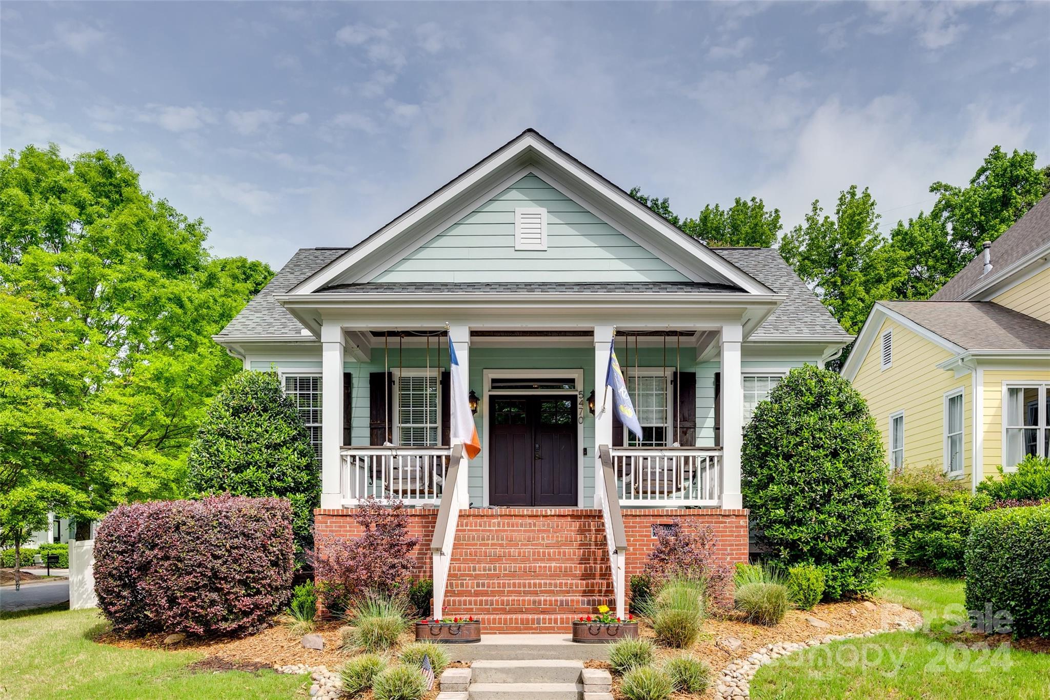 Embrace the charm & sophistication of this rare ranch home, where lifestyle & comfort blend seamlessly. Enjoy the vibrant neighborhood from the inviting front porch, complete w/2 swings, perfect for soaking in the views of the picturesque pocket parks. The wide front entry hall, featuring newly added beadboard on the ceiling, sets a welcoming tone as you step inside. An office with French doors provides an ideal space for work or relaxation, catering to your modern lifestyle needs. Designed for privacy & tranquility, the home's layout places secondary bedrooms & a bathroom in its wing, separate from the spacious primary suite. The primary suite is a true retreat with a sitting area & built-in closets for ample storage. Outdoor living is a delight with a side screen porch ideal for unwinding. This space leads to the fenced side yard, perfect for pets or play. The expansive fenced backyard borders a serene wooded lot, offering a peaceful backdrop & plenty of space for outdoor activities.