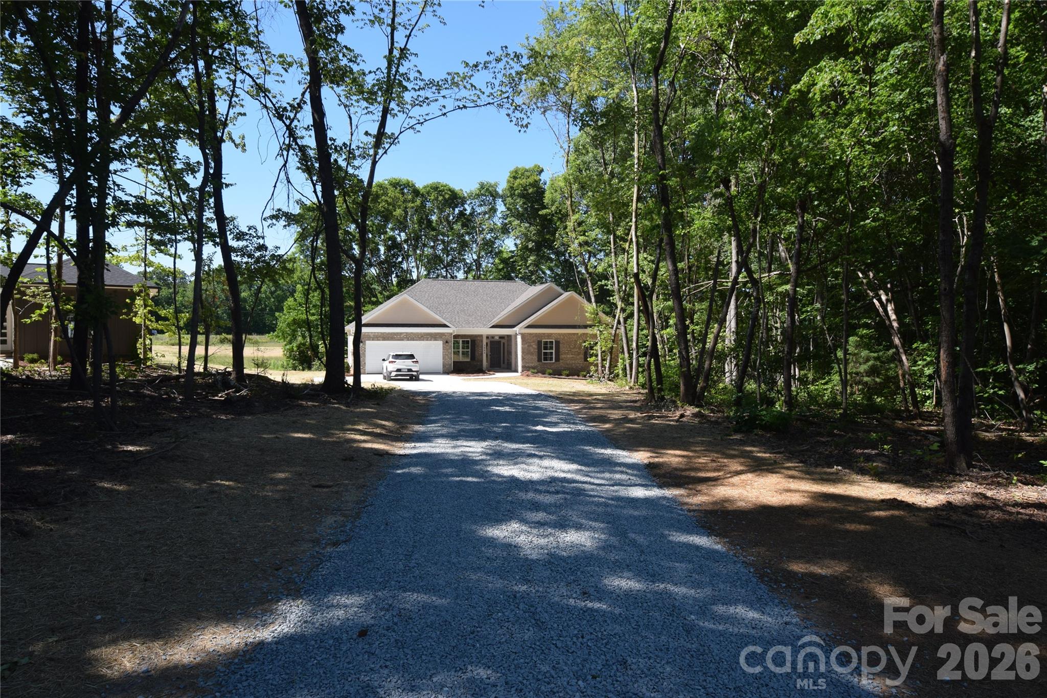 1.56 acres custom built brick home private setting  sunny open floor plan Great with fireplace fully equipped kitchen with extra cabinets  dinning area with custom molding breakfast area overlooks private rear yard   quartz  counter  tops  walk in shower   soaking tub  covered rear porch  Builder incentive  $7500
