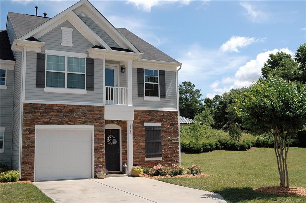This beautiful end-unit townhome won't last long! Features include 3 bedrooms and 3.5 baths! Two-story great room and open loft area that could be used as a 2nd living area, office space or kids playroom. Kitchen has granite counters, stainless steel appliances and tile backsplash. Hardwood floors in the entryway, dining room and kitchen. Great fenced-in backyard with patio perfect for entertaining or relaxing. Large grassy common area to the side provides the perfect extension for entertaining.