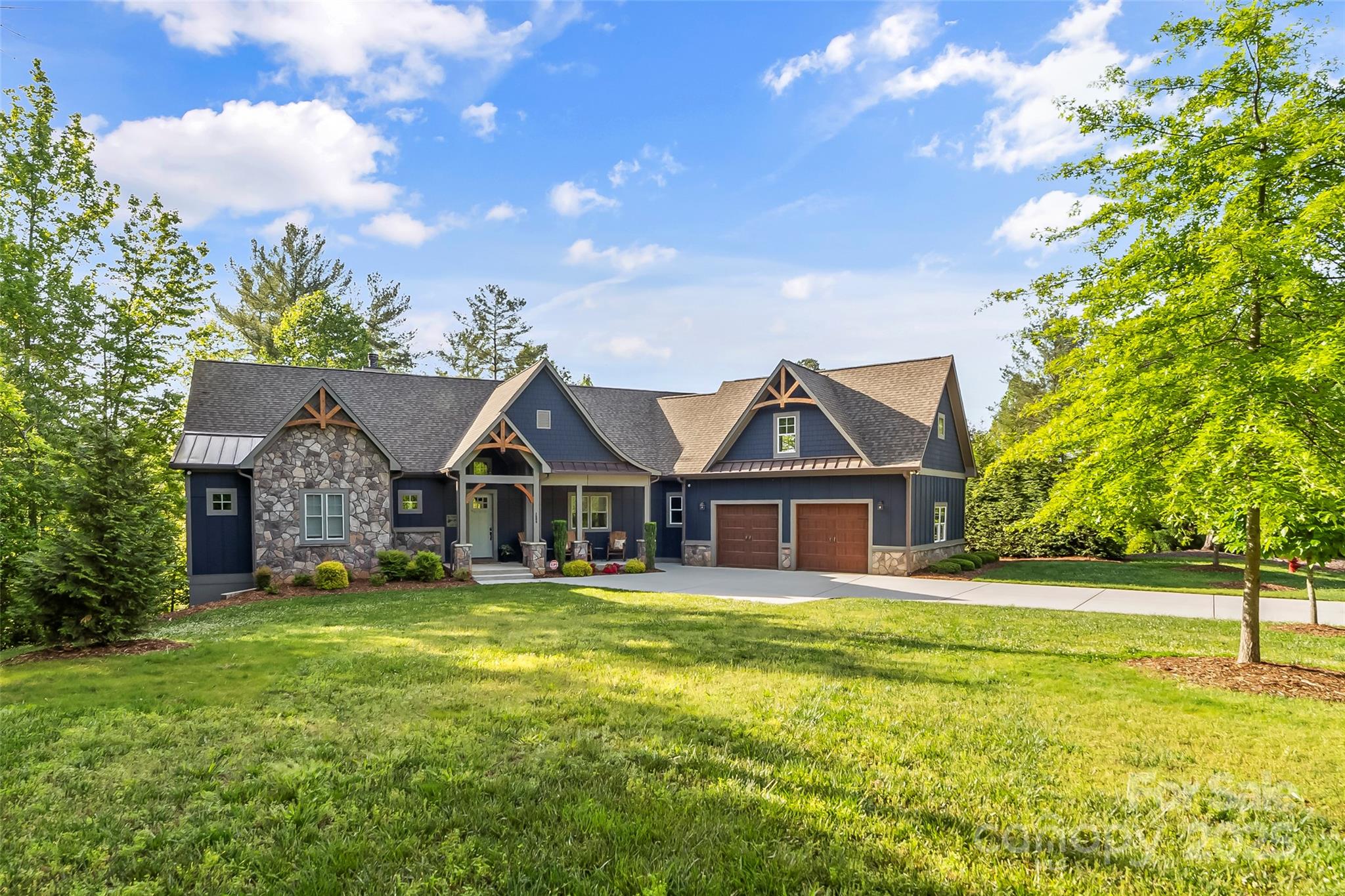 HUGE PRICE IMPROVEMENT!!  Premiere Lake James Waterfront Property/Turnkey Luxury! Live the ultimate lakefront lifestyle in this fully furnished, luxury home tucked in a private deep water cove in Southpointe on Lake James. Designed for seamless indoor-outdoor living, the open floorplan features a wood burning fp,gourmet kitchen,dining area & expansive deck with panoramic lake views. The screened porch & lakeside gazebo make entertaining effortless. Your private dock includes a 26 ft South Bay Pontoon, 19ft Stingray Ski Boat & lift. The primary suite offers spa- like comfort, w 2 guest ensuites on main level. Walkout lower level boasts a wet bar,home theater, gym,sauna, hot tub patio & 2 more bedrooms. An oversized garage fits your trailer & 594 sq ft finished bonus room above is ideal for an office, art studio or guest retreat (not included in total living area) Enjoy Southpointe amenities like clubhouse, pool, & trails. Everything is turnkey- just bring your clothes & jump in the lake