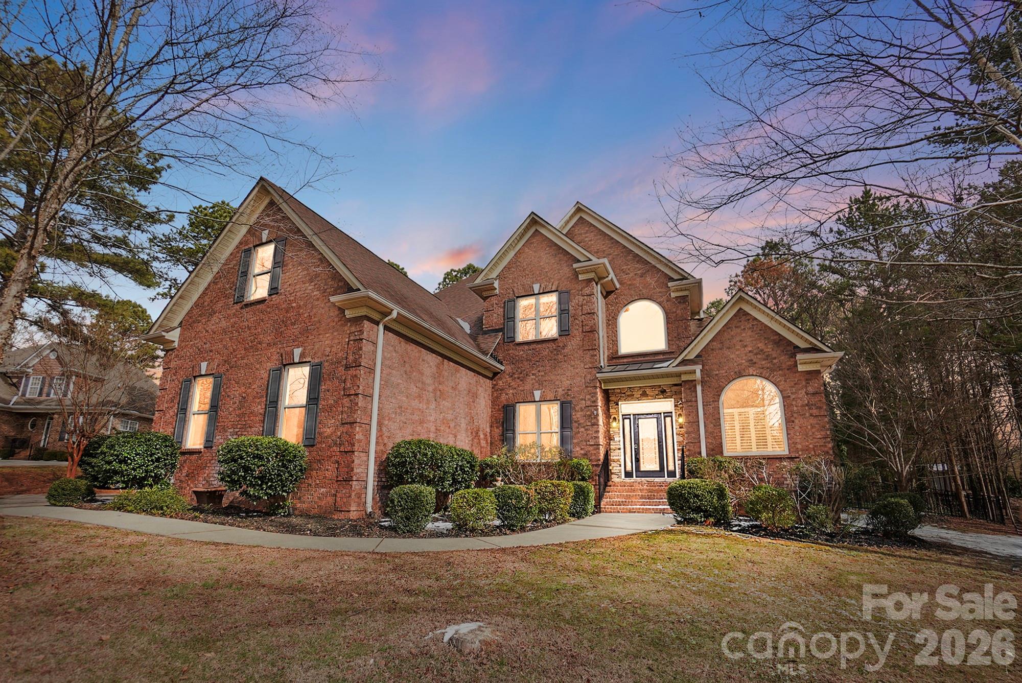 Welcome to 160 Arrow Point Lane in Davidson, located in the desirable Archer Ridge community. This brick home features a huge fenced backyard and multiple spaces designed for relaxing and entertaining. The open floor plan showcases a spacious family room with soaring ceilings, built-ins, and a stunning rock fireplace that flows into the kitchen and living areas. Enjoy both a breakfast area and formal dining room for gatherings. The oversized primary suite offers a tray ceiling, sitting area, large bath, and generous closet space. One of the standout features is the expansive screened porch overlooking a paver patio—perfect for outdoor enjoyment. Upstairs provides ample bedroom and bath space. A must-see home!