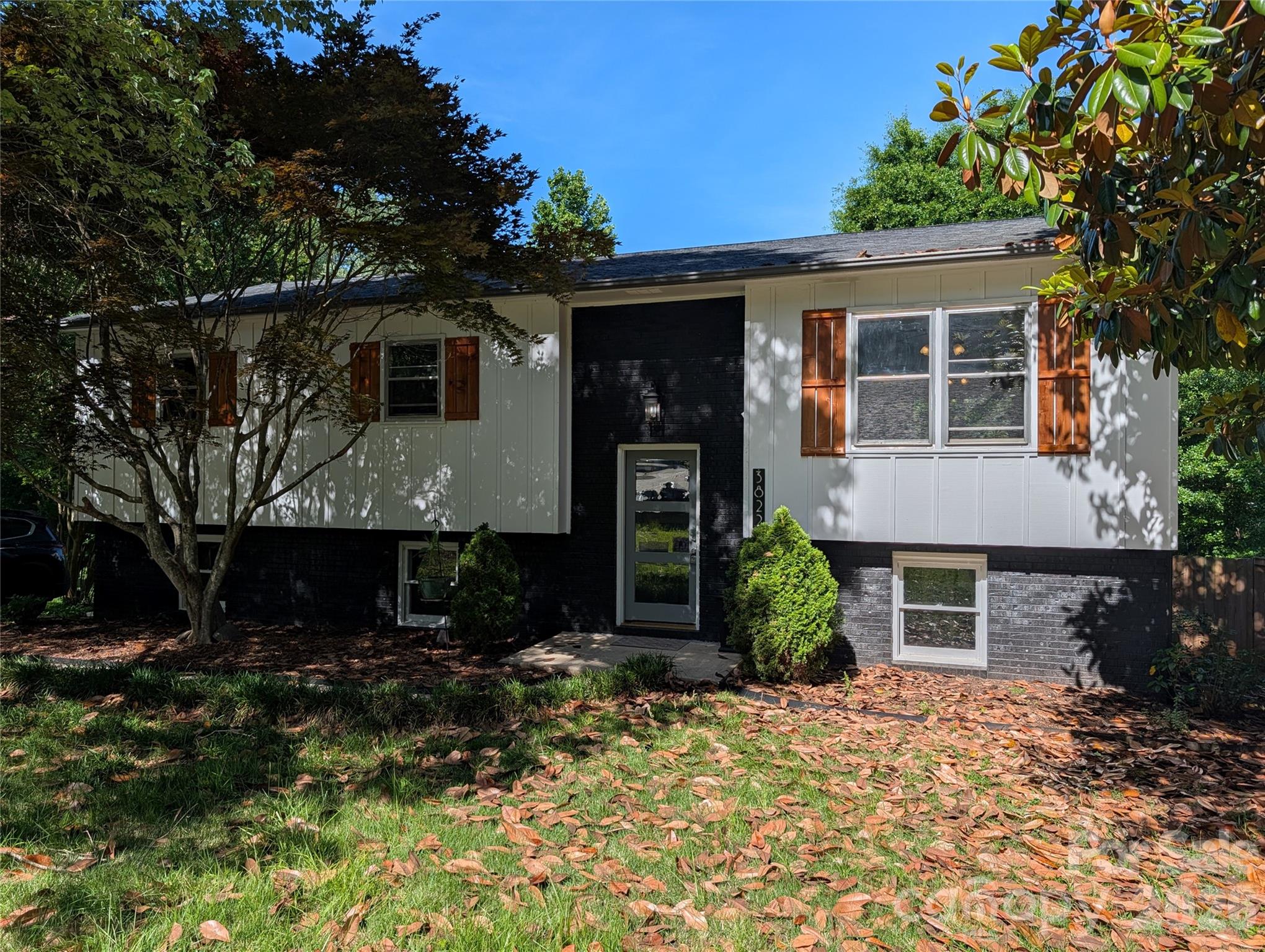 Welcome home to this spacious and versatile two-level property offering room to live, work, entertain, and grow. The thoughtfully designed main floor features a bright kitchen that flows into the dining area, creating a natural gathering space. Just off the dining room, step onto the deck—an ideal spot for morning coffee, outdoor dining, or relaxing while enjoying the outdoors. The main level also includes a comfortable living area, three bedrooms, and a full bathroom, providing convenient everyday living on one floor. The Ground level expands the home's possibilities with a large private bedroom featuring a generous closet, a full bathroom, and a dedicated laundry area. A spacious living room with a fireplace creates the perfect setting for movie nights, gatherings, or a cozy retreat. One of the home's standout features is an additional oversized room filled with natural light from patio doors leading directly to the outdoor patio. This flexible space can serve as a home office, recreation room, playroom, second living area, hobby room, fitness space, or creative studio. Beautiful hardwood floors, fresh interior paint, and included appliances—refrigerator, range, microwave, dishwasher, washer, and dryer—add value and convenience. With multiple living areas, flexible-use spaces, and indoor-outdoor entertaining options, this move-in-ready home offers exceptional versatility for today's lifestyle. Nestled under trees, the 12‘ x 16‘ storage building is perfect for storing your lawnmower and other equipment.