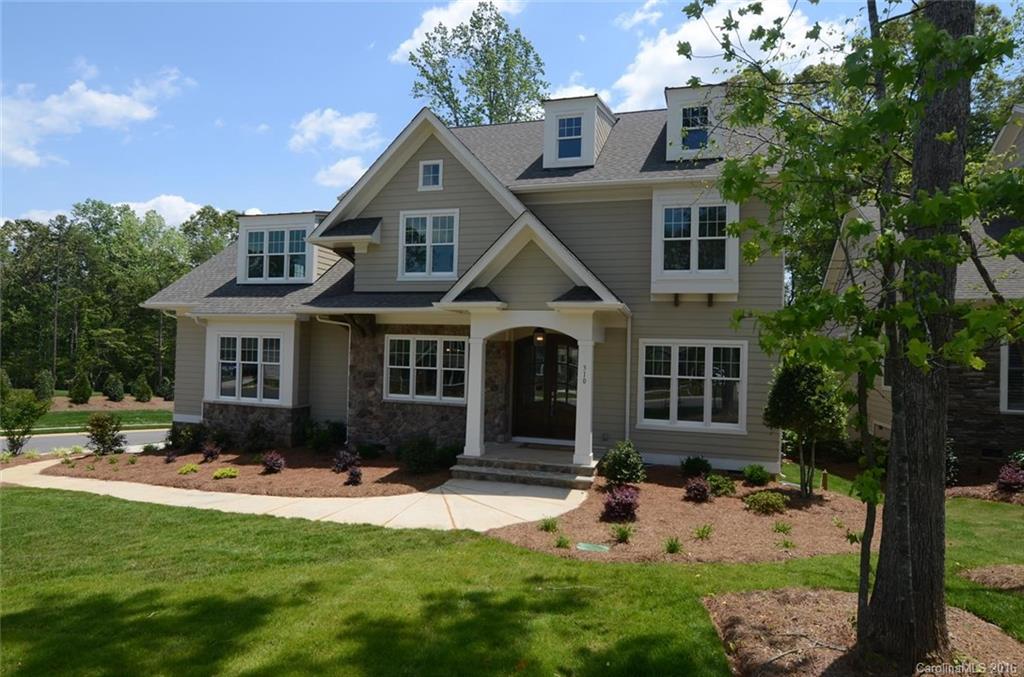 Move in February 2016. Located in desirable custom home phase of Springfield. Expansive open plan with room for the ENTIRE family! Beautiful designer selected finishes like upgraded tile, quartz tops, built-ins, light fixtures, Master suite on the main level, Laundry on main and 2nd floors, Fantastic porch with gas fireplace. Huge master bedroom closet. Environments for Living Platinum Certified. Springfield residents get membership to the Anne Springs Close Greenway.
