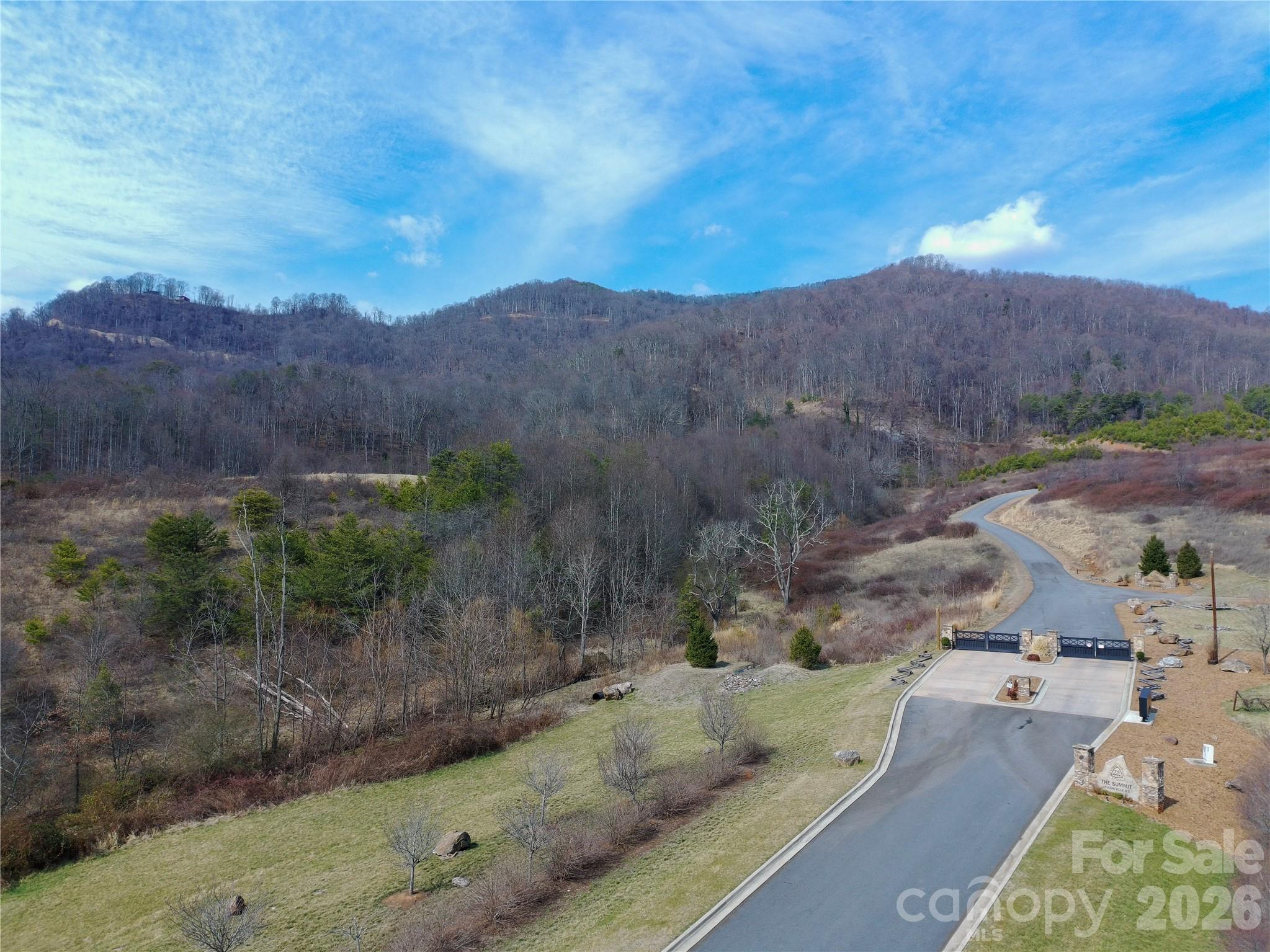 The Summit of Asheville • 10.05 acres • Gated community • Paved access • Panoramic mountain views • Haywood County near Canton • Close to I-40 and US-74

If you’ve been picturing a place where mornings start with mountain air and the view does the talking, Lot #15 Summit View Drive delivers. Set on 10.05 acres in The Summit of Asheville in Beaverdam Township, this homesite gives you room to spread out, breathe, and build at your own pace. The land carries that classic Western North Carolina feel: quiet woods, natural privacy, and the potential for long-range Blue Ridge views as you move higher on the property.

Located in the mountains of Haywood County near Canton, it’s an easy spot to enjoy peaceful mountain living without feeling far from everything. Spend your free time chasing waterfalls, hiking, and exploring—Pisgah National Forest and the scenic Blue Ridge Parkway are close by and known for trails, overlooks, and those big-sky moments that never get old.

The Summit of Asheville is a gated community with an outdoor-minded vibe and community amenities that support time outside. Paved road access is in place. Utilities have been reported available in the community, and buyers should verify availability, connection requirements, and any associated costs for this specific lot. Well and septic are needed; buyer to verify suitability and permitting. With convenient access to I-40 and US-74, you can get to Asheville, Waynesville, and Asheville Regional Airport with ease.