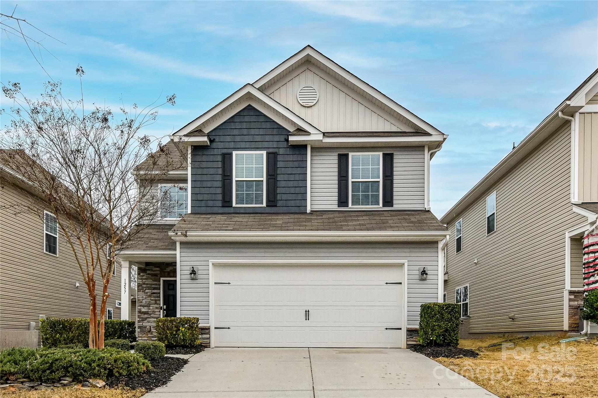 Welcome to this beautifully maintained, nearly new home featuring an open floor plan, modern finishes, and a beautiful back patio space. Enjoy added privacy with no homes directly behind the property. The main level offers luxury vinyl plank flooring and a bright, open layout ideal for everyday living and entertaining. The kitchen features a large island with bar seating, modern cabinetry, and sleek appliances. Upstairs, the spacious primary suite, along with a versatile open flex space, three additional bedrooms, and a full bath. Move-in ready and ideally located minutes from Downtown Waxhaw, near the NC/SC border, with convenient access to shopping, dining, and community amenities.