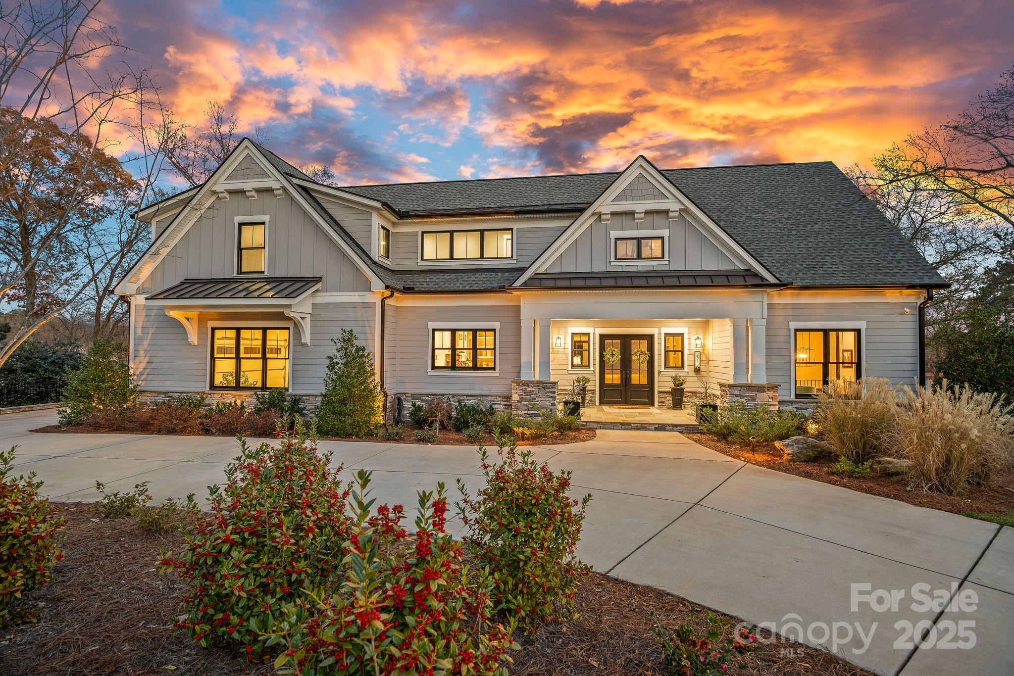 Set on the picturesque shores of Lake Norman, this 2023 custom waterfront home blends exceptional design with everyday comfort. The chef’s dream kitchen features a Scullery, expansive cabinet and counter space, large island, and Thermador appliances. The open floorplan enjoys sweeping lake views from every room and provides seamless indoor–outdoor living. The main level also features a lakefront primary suite, two offices that offer flexibility for work or creativity and a laundry area that includes a drop zone, wash sink and a dedicated pet shower. The lower level features three additional bedrooms, spacious recreation area with wet bar, gym with rubber flooring, and expansive storage areas including a hidden-door workshop. The upper level adds a versatile flex room and large walk-in attic spaces. This Lake Norman Home Builders Association “Best of the Lake” Award-winning home was designed by KDH Design and meticulously built by Tim Whelan Homes.  Everyday comfort is elevated with energy-efficient doors, windows, and HVAC systems, extensive air and water filtration systems, and a whole-house generator for peace of mind. Outdoor living excels with a heated in-ground pool and spa, along with a rare grandfathered two-story boathouse featuring a climate-controlled finished upper level ideal for an office, art studio, or flex space. The epoxy-floored lower level opens to the concrete boat ramp and includes a working power winch for easy lake-toy handling. A floating covered dock with boat lift and PWC docks completes this premier lakeside retreat.
