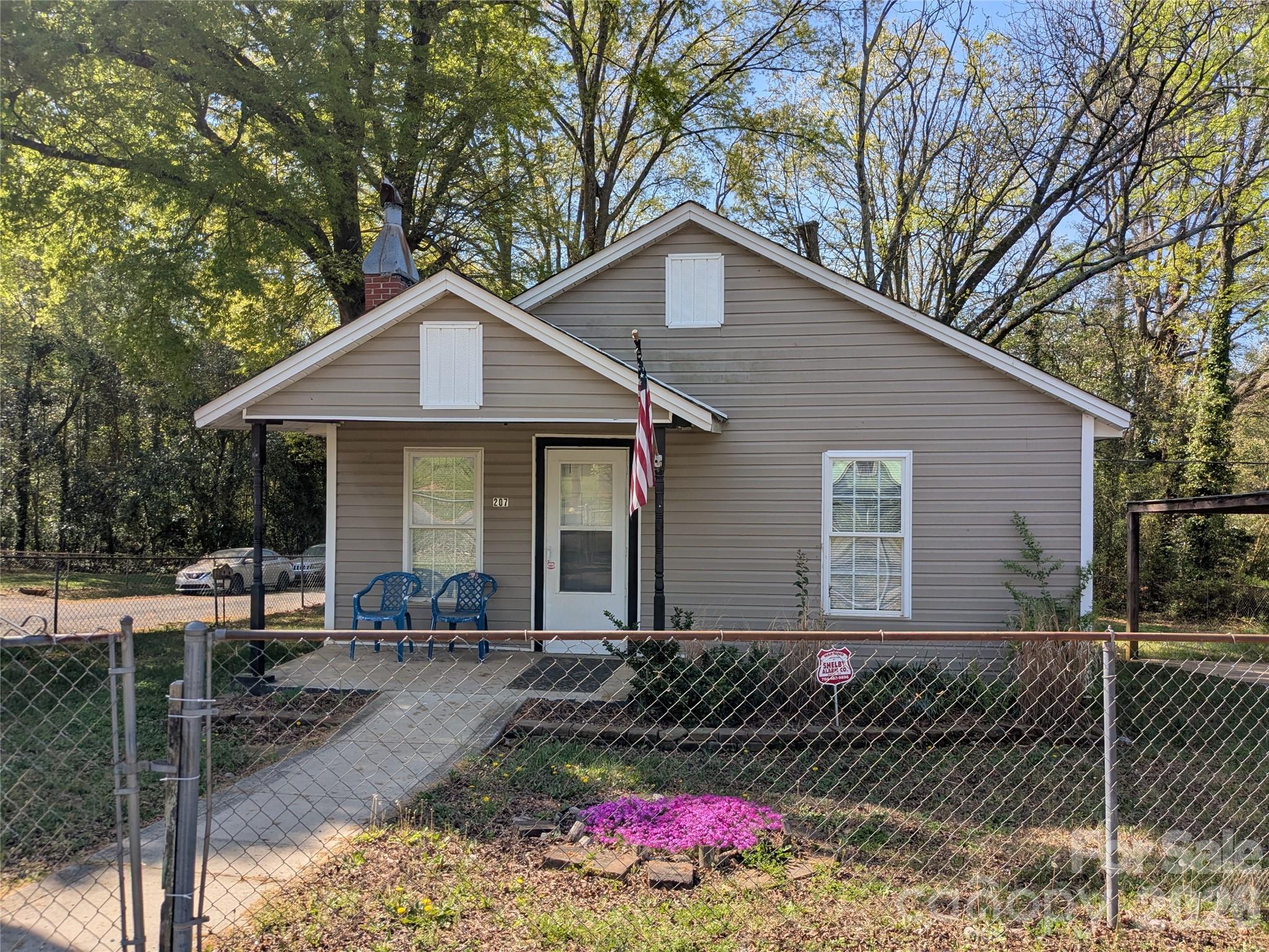 Beautiful remodeled home.  New paint, new carpet, appliances include refrigerator with ice maker and new washer and dryer.  Carport and fenced yard.  Enjoy sitting on your covered porch or visits to nearby up town restaurants.  Hurry on this one.