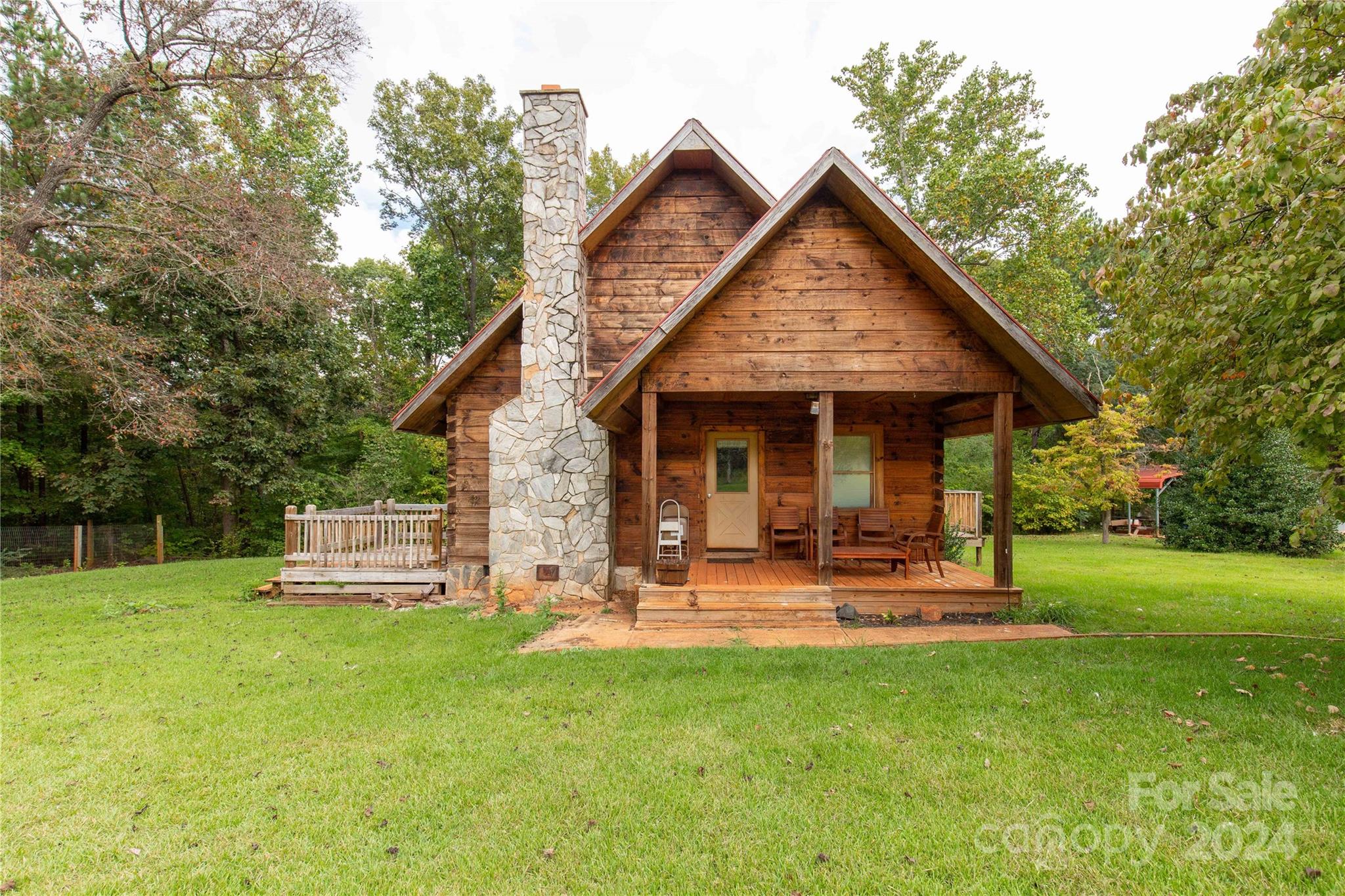 You will fall in love with the coziness of 1460 Fernwood! Well maintained log cabin with some moderate updates. Offering two bedrooms and one full bath, a large loft, and a beautiful brick fireplace. This home also provides five private acres with several outbuildings.