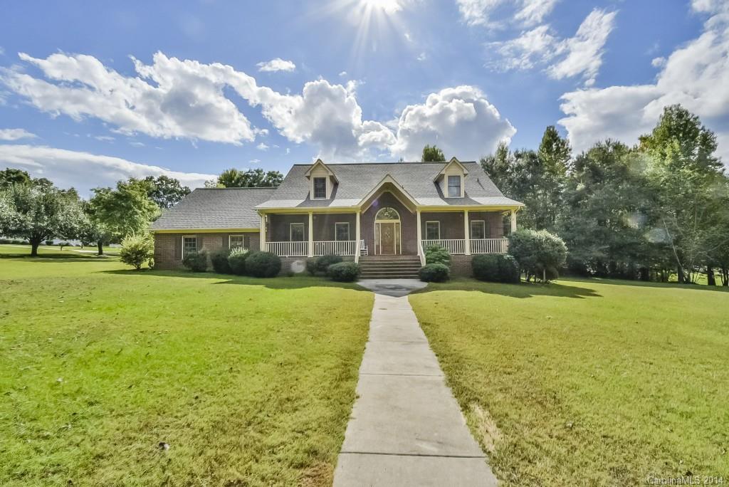 This home is a true gem! With construction that is second to none, this solidly built custom home offers hardwood flooring & beautiful molding/wood trim throughout!  Additional flooring types include ceramic tile & vinyl. The spacious Master BR is conveniently located on the 1st floor with an adjoining master bath. Situated on a spacious acre+ lot, with in ground swimming pool, and oversized garage, this home boasts a covered rocking chair front porch & a screened in back porch!