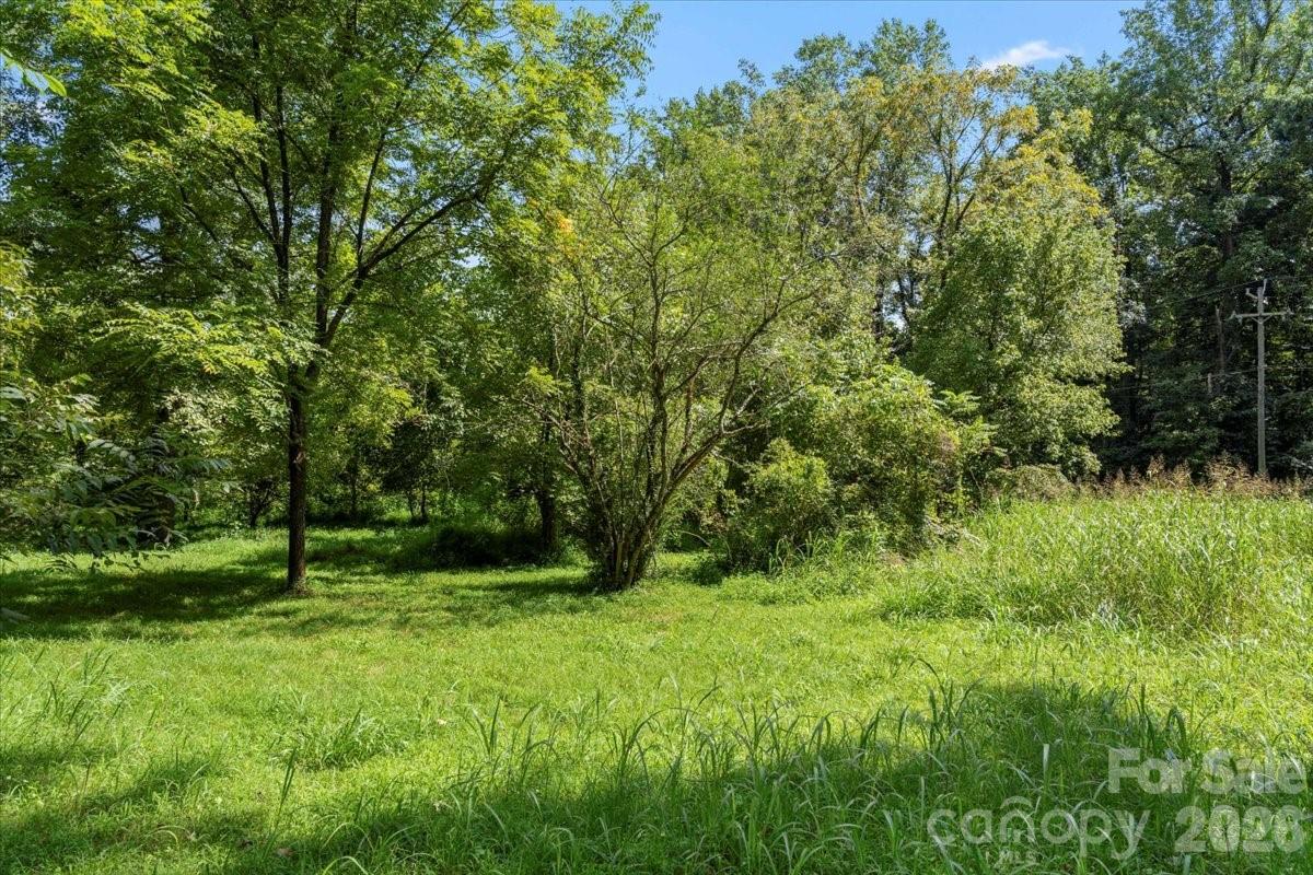 New lower price!  Perfect residential location.  Own a 3.31 acre lot in the heart of Mount Holly. Mostly wooded, but most of it can be cleared easily. Fites creek runs through the south corner of the lot. Portions of the lot are in the 100 year floodplain because of the creek. Do not walk the lot without a licensed real estate agent. You can pull into the lot near the for sale sign.