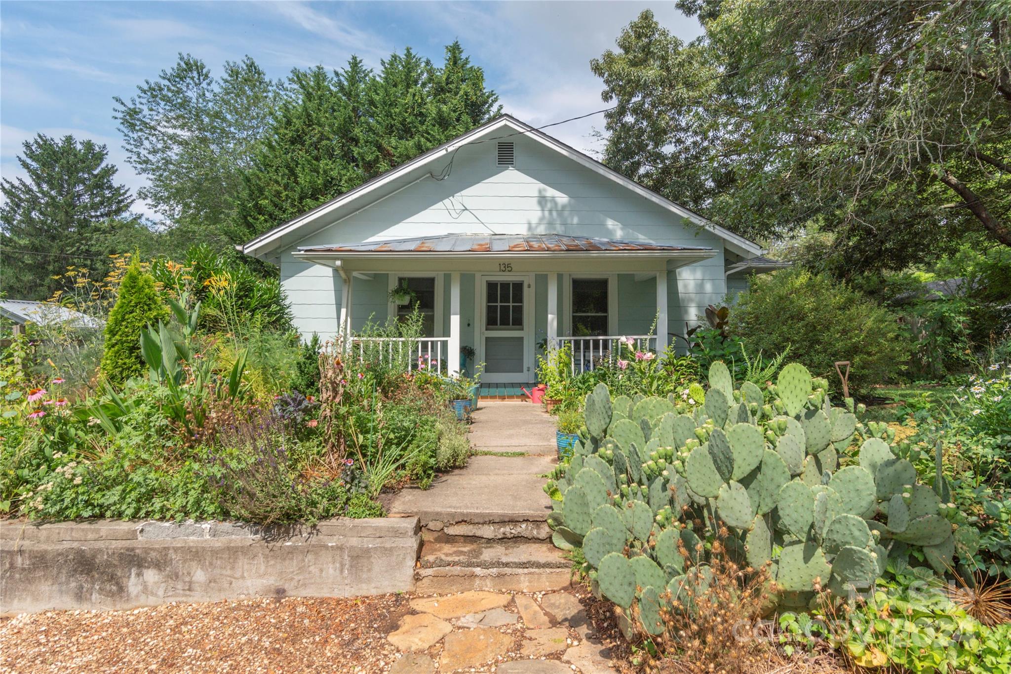 A stone's throw to the heart of West Asheville's vibrant shopping, dining and cafes, this updated 1926 bungalow features spacious one level living with a completely new 1BR/1BA basement apartment. Delightful blend of historic charm and expertly designed renovations for modern living. Gleaming hardwood floors throughout the main level and a smart, flowing floor plan. Bright Dining area connects to the cheerful kitchen with gas range. Enjoy the lovely greenery and landscaping on the "just right" sized corner lot from the abundant windows as well as the great outdoor living spaces in front and back. Clean, bright storage space in the unfinished portion of the basement. Don't miss this perfect opportunity for West Asheville living!